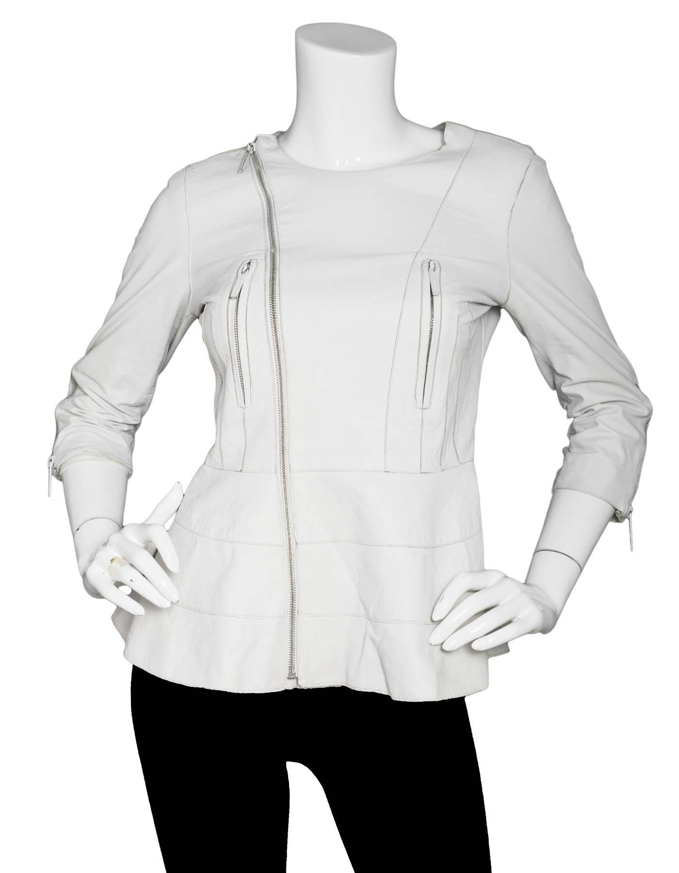 Catherine Malandrino White Leather Moto Jacket Sz 2

Made In: China
Color: White
Composition: 100% Lamb leather
Lining: White mesh
Closure/Opening: Zip up front with snap at neck
Exterior Pockets: Two front zip pockets
Interior Pockets: none
Overall