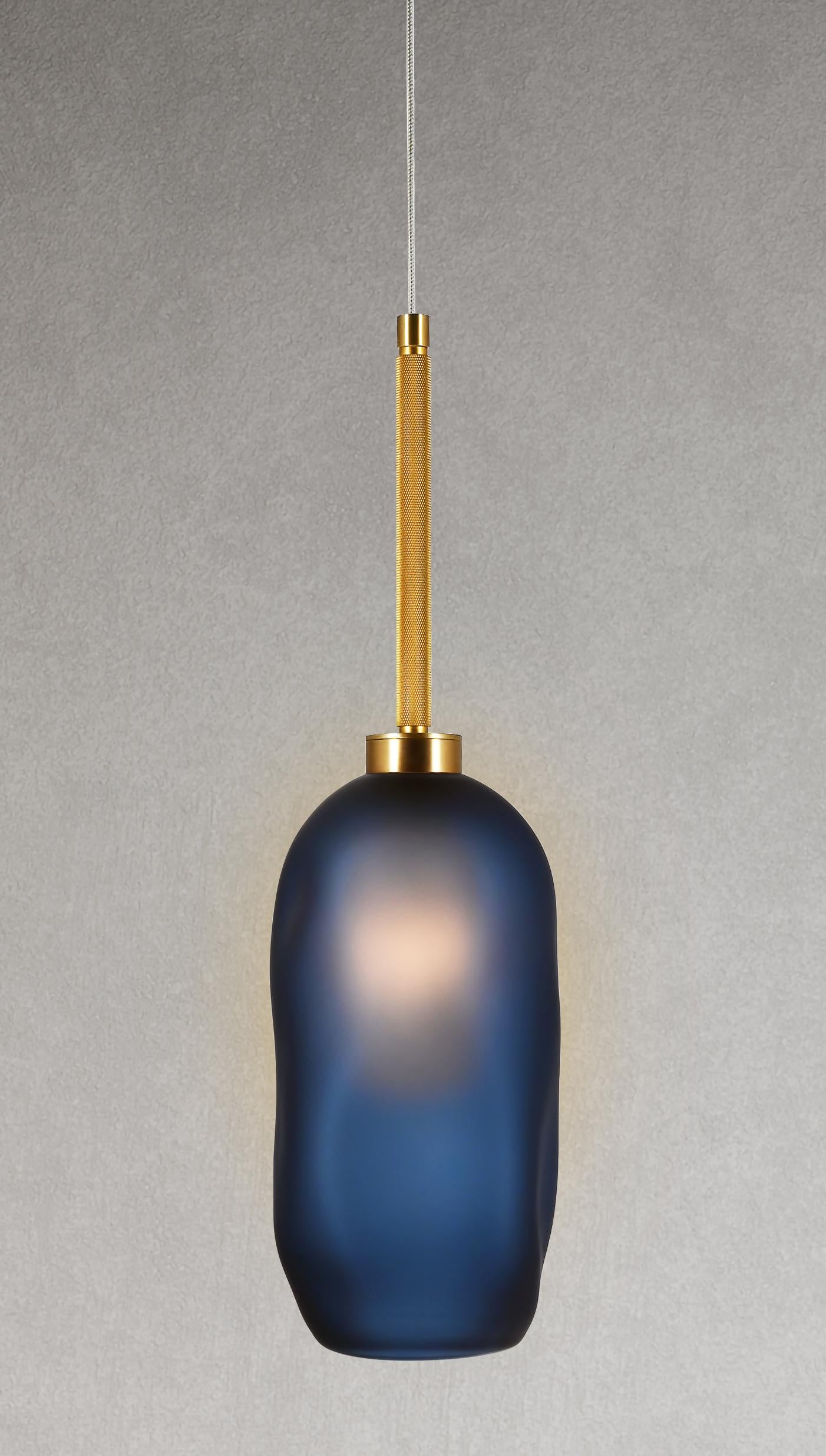The Catherine can be displayed as a hanging pendant, wall sconce, or grouped in multiples. Our most versatile design also has a new, elevated look: a tubular oval glass diffuser that perfects the art of the soft glow. Balanced by the masculine edge