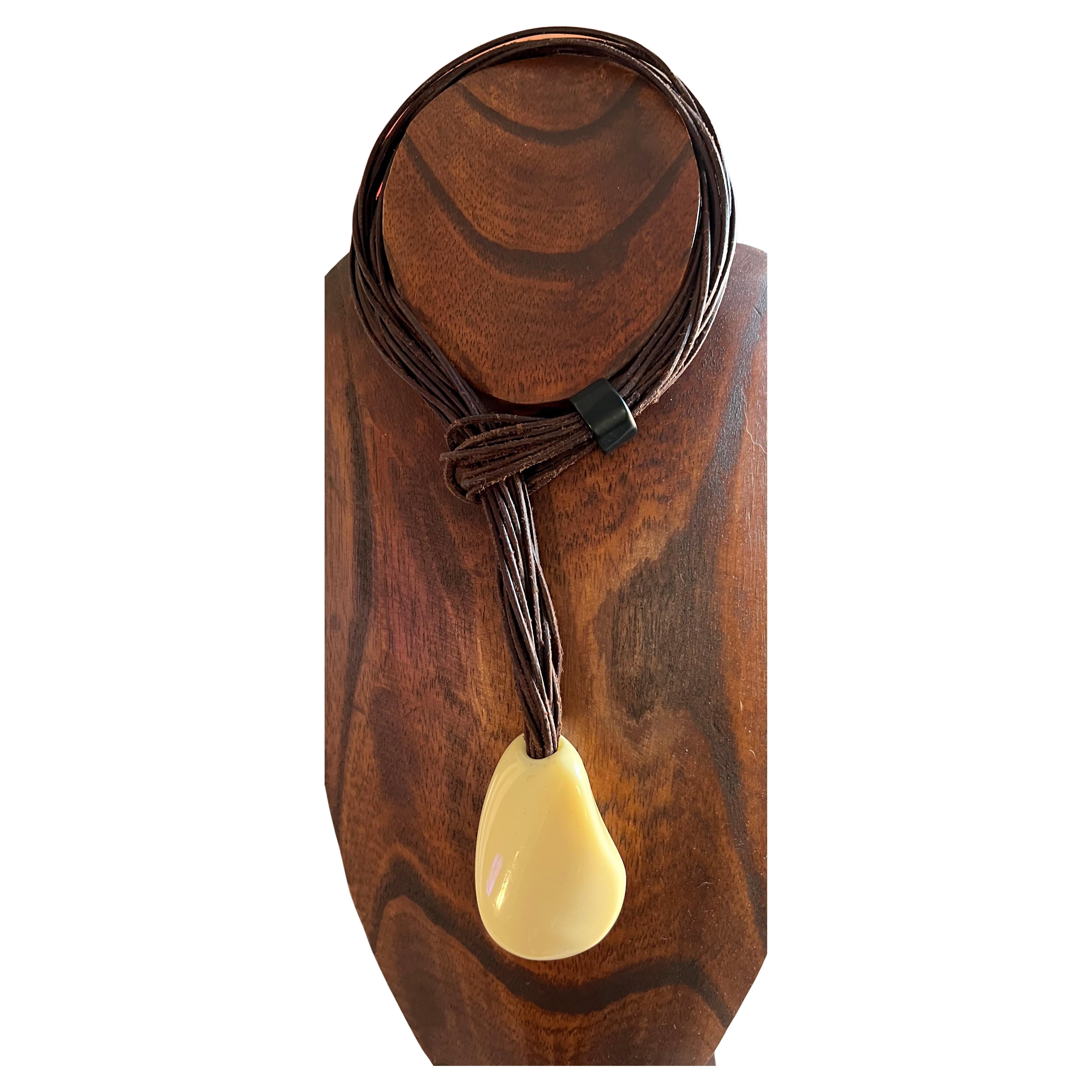 Vintage 1970s leather with resin drop necklace created Catherine Noll of France.  Brown leather portion measures 19