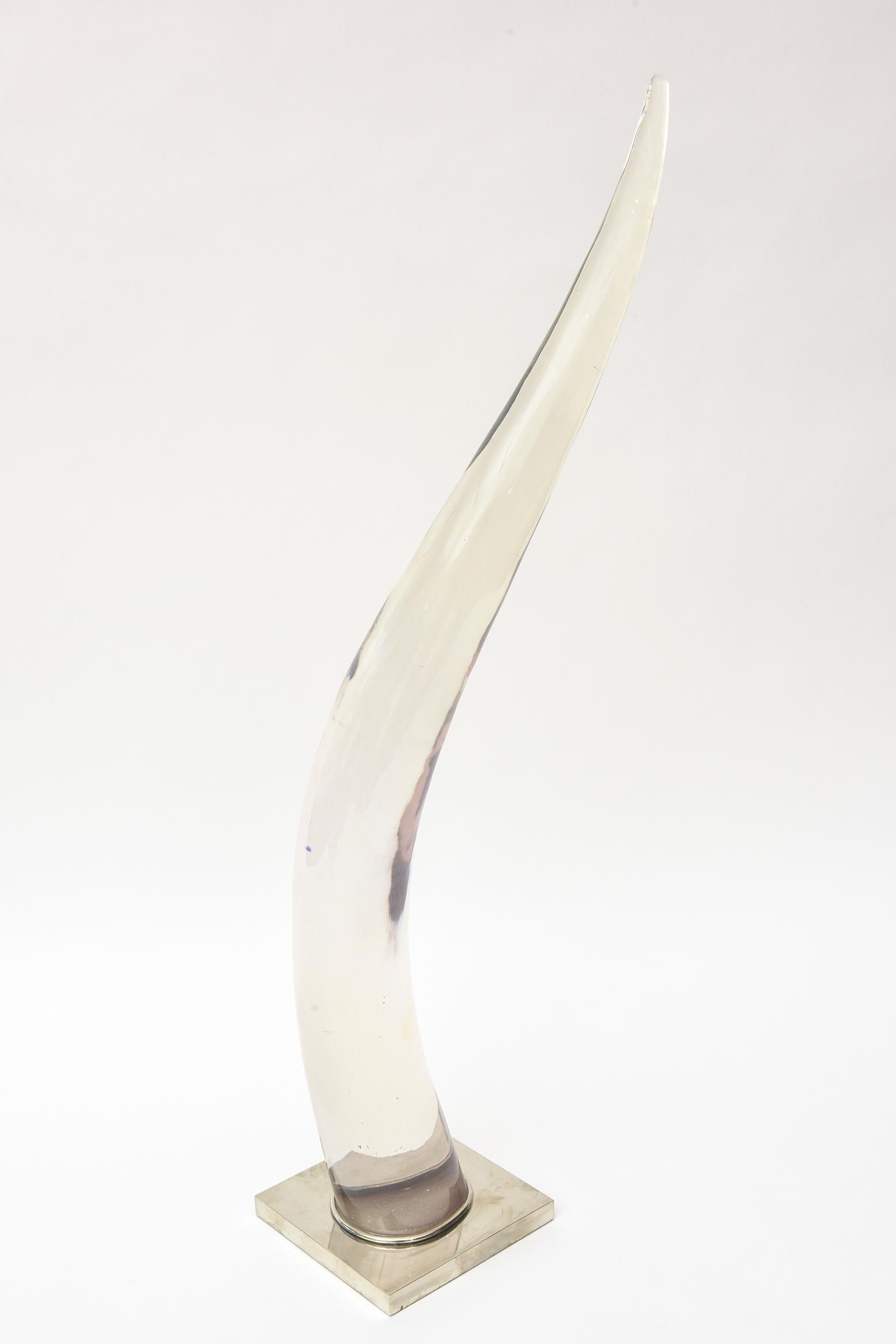 This special tall lucite and silver plate elegant and organic arched sculpture was designed by Catherine Noll whose famous grandfather was Alexandre Noll. He was a well know sculptor who made fabulous sculptures out of carving simple wood. This