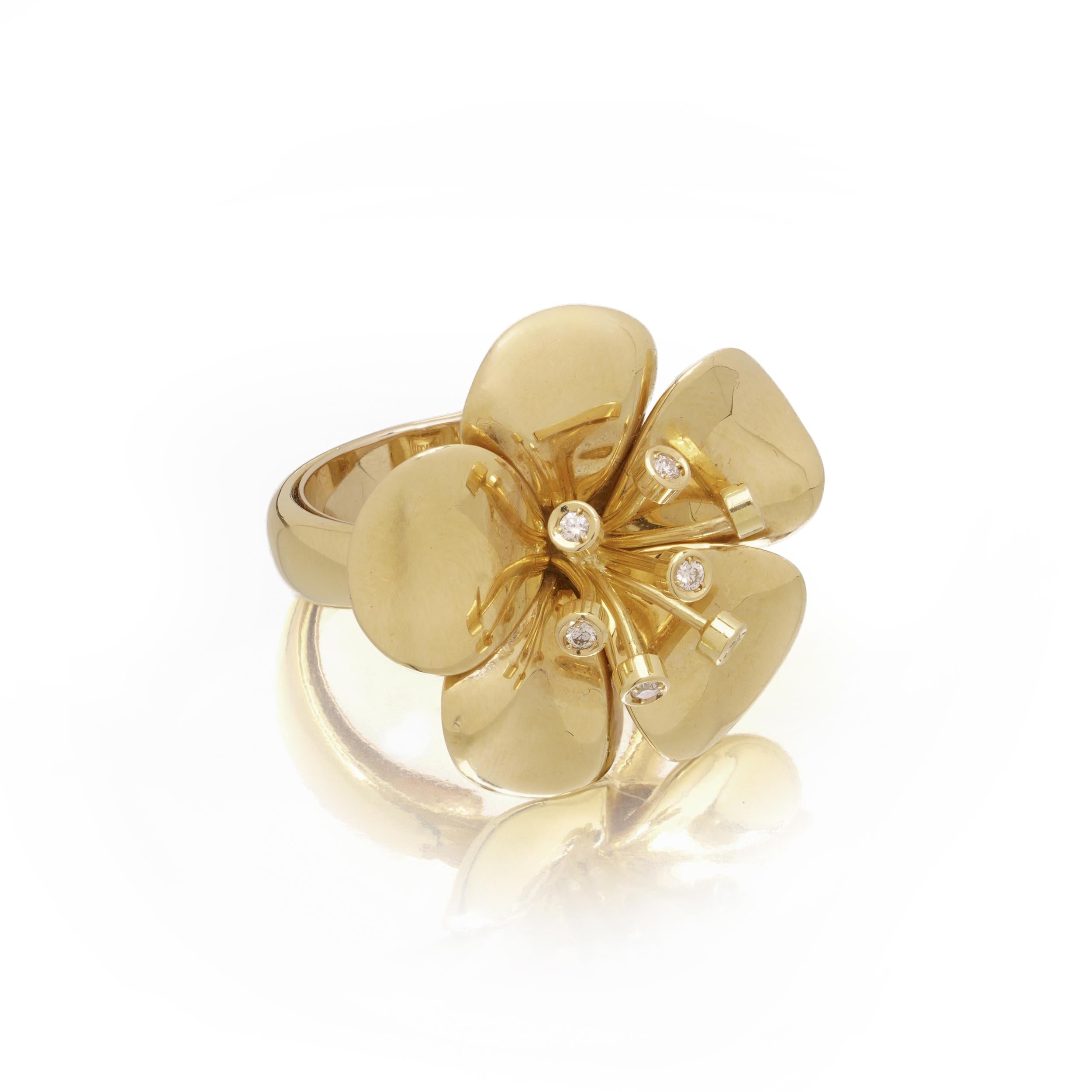 An eye-catching sculptural ring by Catherine Prevost, designed as a stylised flower head in high-polished 18 karat yellow gold. Each petal is organically domed, converging at the centre where eight round brilliant-cut diamonds are set in pin-like
