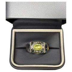 Catherine Prevost Peridot oval in Opalescent crystal in 18k gold ring.