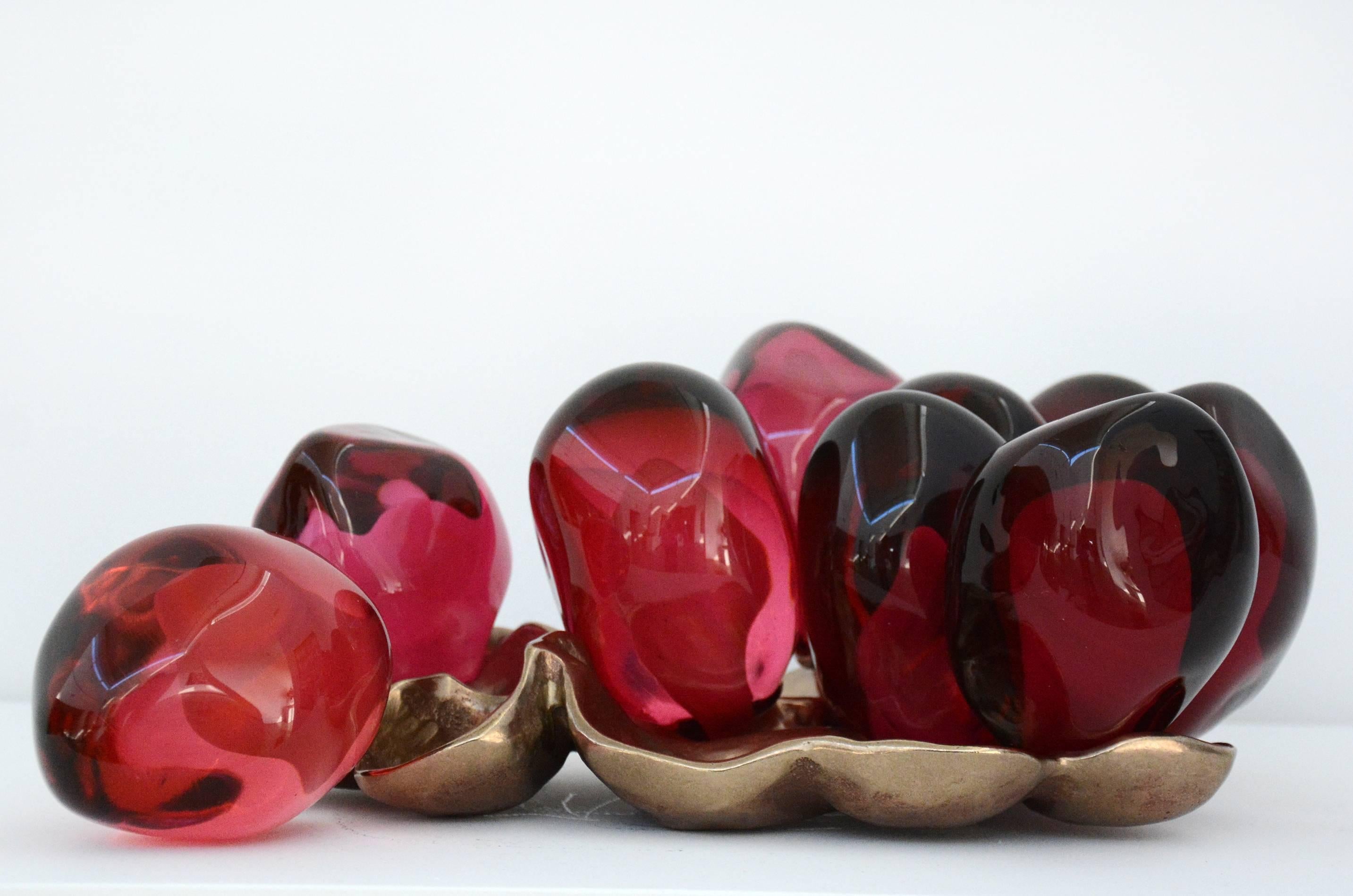 Catherine Vamvakas Lay Still-Life Sculpture - Pomegranate Seeds Nestled on Bronze I - bright, red, glass, still life sculpture