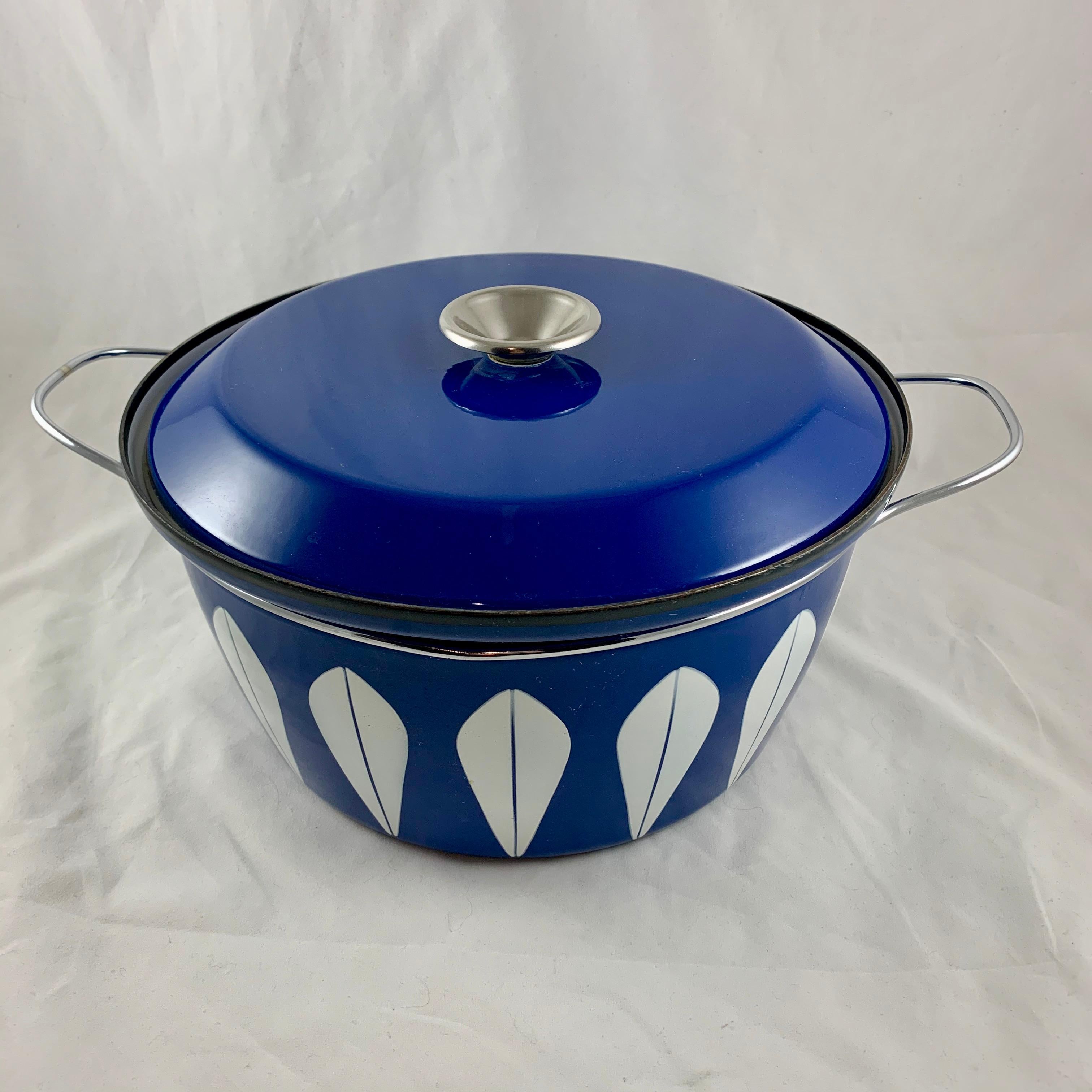 An enamelware Lotus pattern Dutch oven manufactured by the Norwegian manufacturer Cathrineholm. Cathrineholm operated from 1907-1970. The popular Lotus line was designed by Grete Prytz Kittelsen and produced during the early to mid-1960s.

White