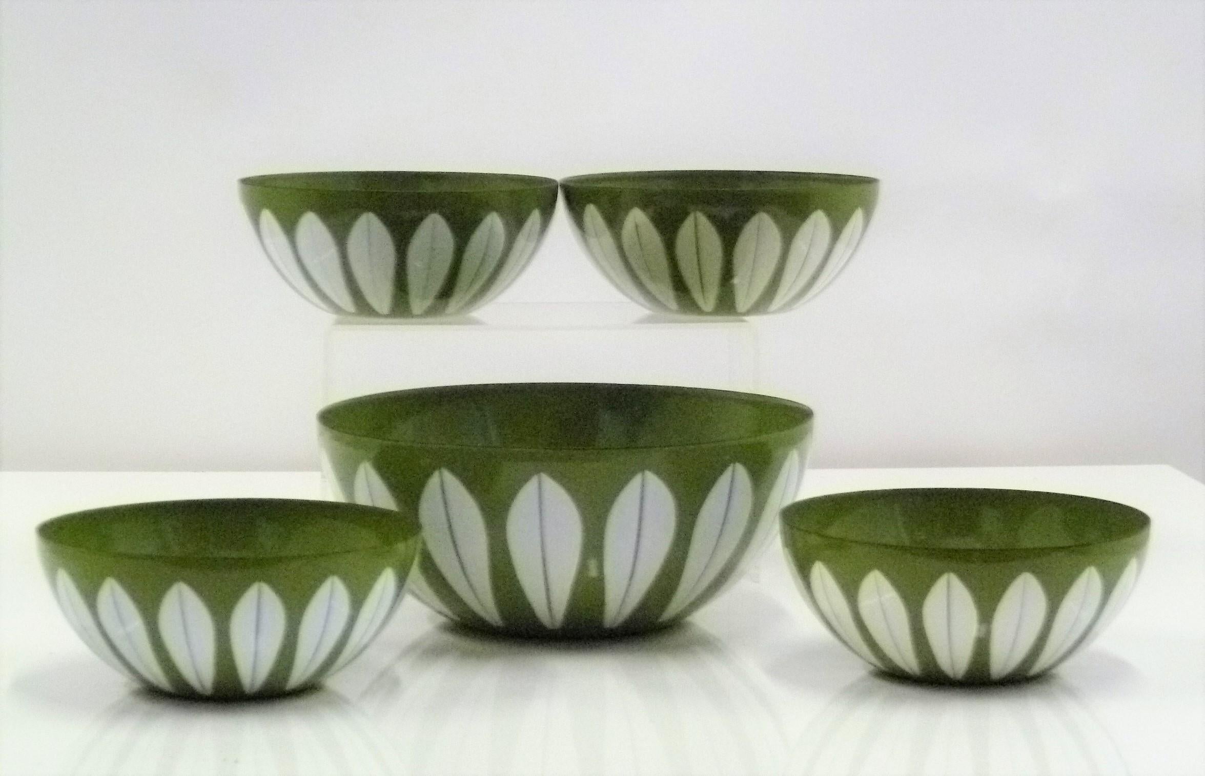 Midcentury Scandinavian Modern enameled Olive green lotus bowls designed by Grete Prytz Kittelsen. Set of five bowls consisting of one larger 8 in. diameter, and four smaller 5.5 in. diameter bowls made by CathrineHolm of Norway. In very good