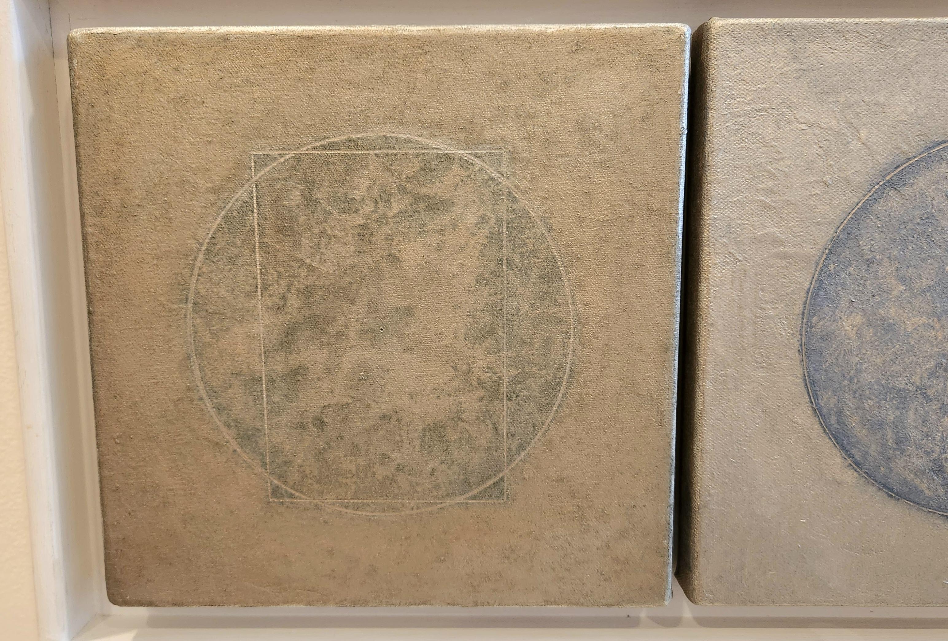 In each of these pieces is a blue circle in the center, with rectangles in two, over a silver metallic background. The blues used in each of these is very nuanced in how it is applied to the canvas that brings out the unique texture of the works.