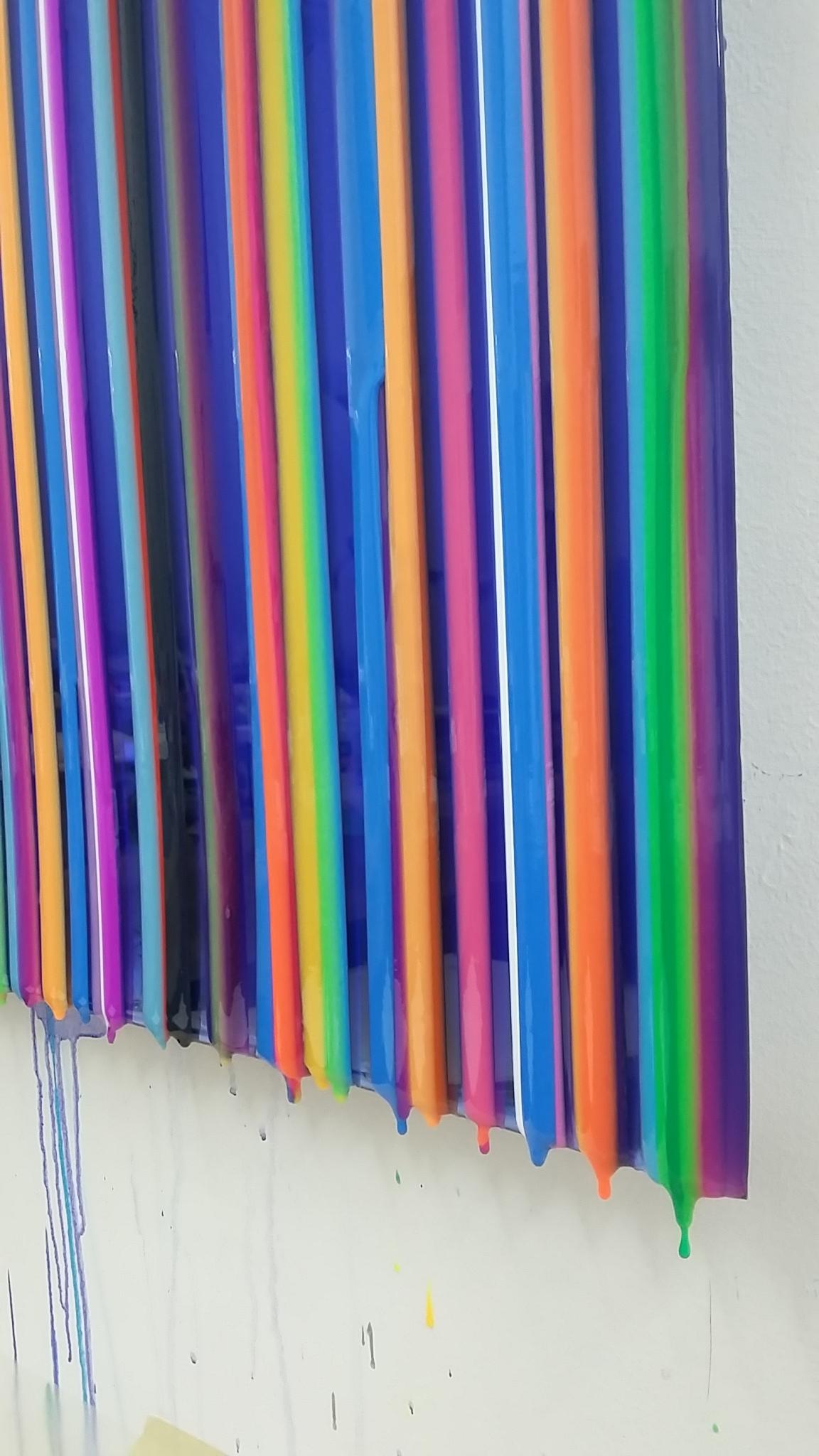 Choi’s striped colorful work has a beautiful highly glossed surface.
This work is very organic.  Surfaces drip and extend outwards.
Finding inspiration from the physical and metaphysical qualities of water, Cathy Choi paints with pigmented resin,
