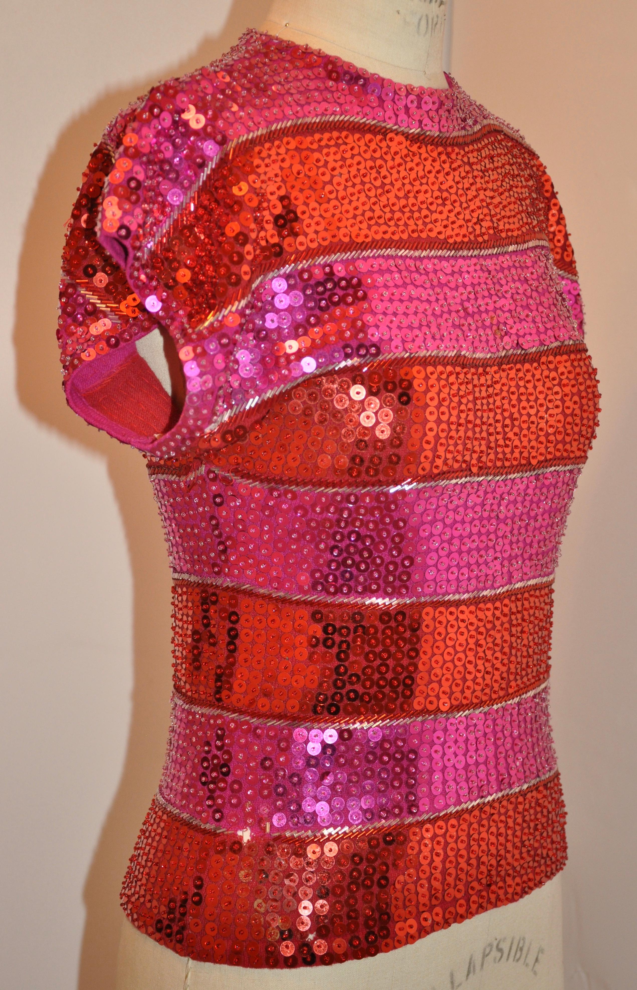    Cathy Hardwick eye-popping body-hugging fuchsia & red sequined sweater made of lambswool and nylon blend is accented with stripes of sequined bugle beads in-between. Measurements taken at 