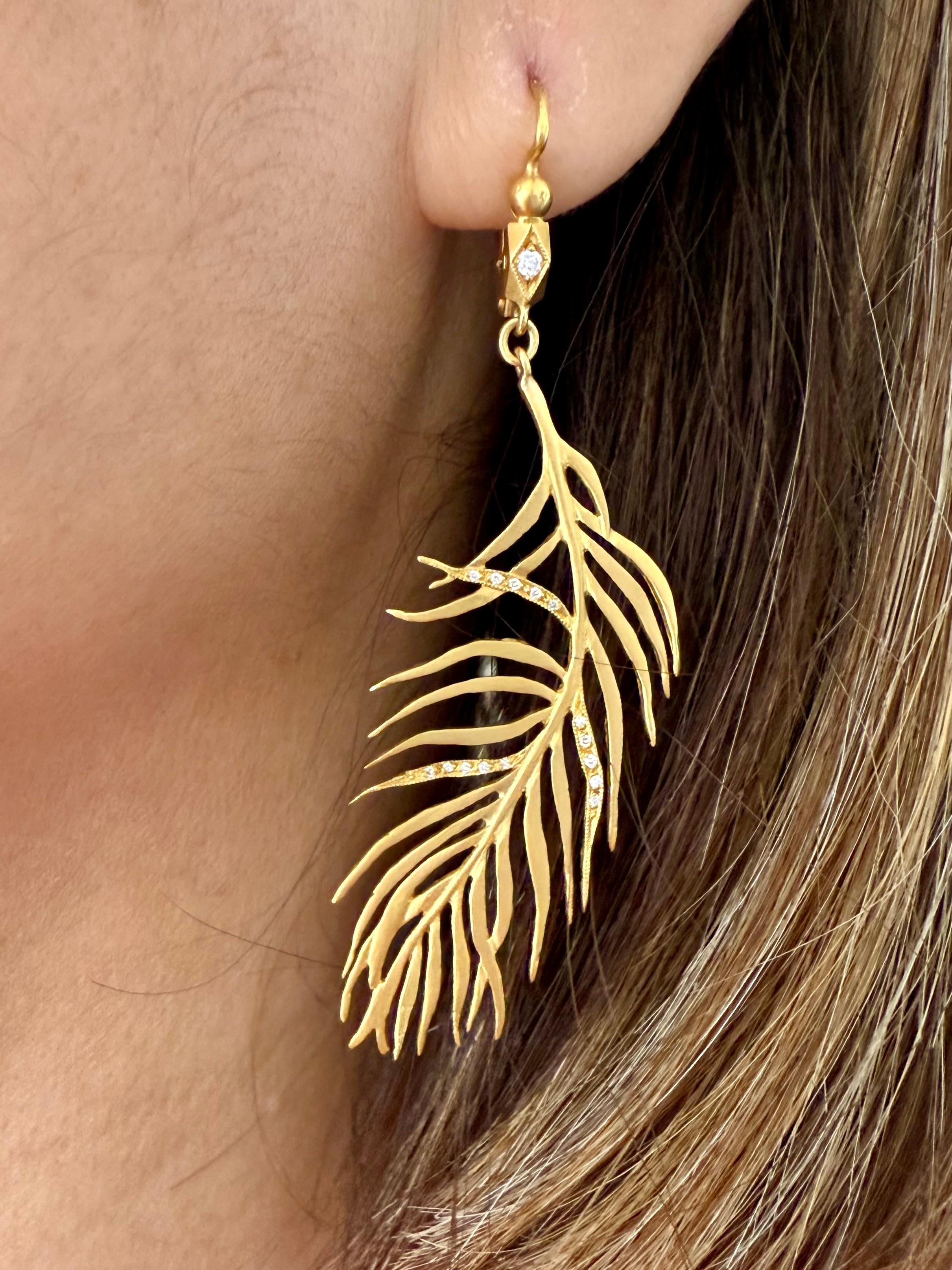 Cathy Waterman
Float through your day with these effortlessly chic diamond feather earrings from Cathy Waterman. Each gold feather is intricately handcrafted and accented with diamond ear wires.

Handcrafted in 22-karat yellow gold.
Detailed in