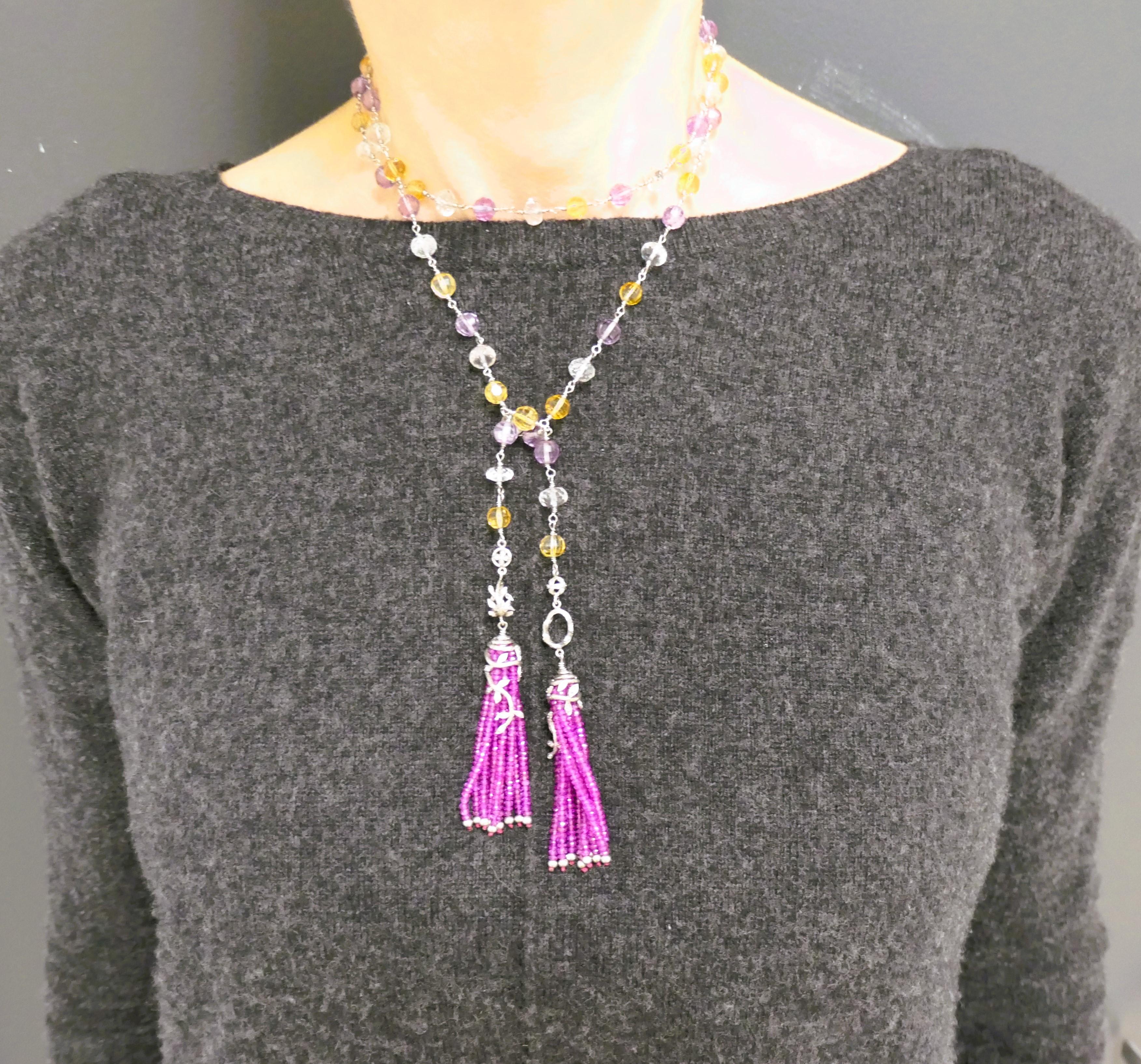 A gorgeous necklace by Cathy Waterman crafted out of multi color sapphire beads with platinum elements.
The carved sapphire beads of white, yellow, purple and pink color are strung on a twisted platinum wire. The ends of the necklace are designed as