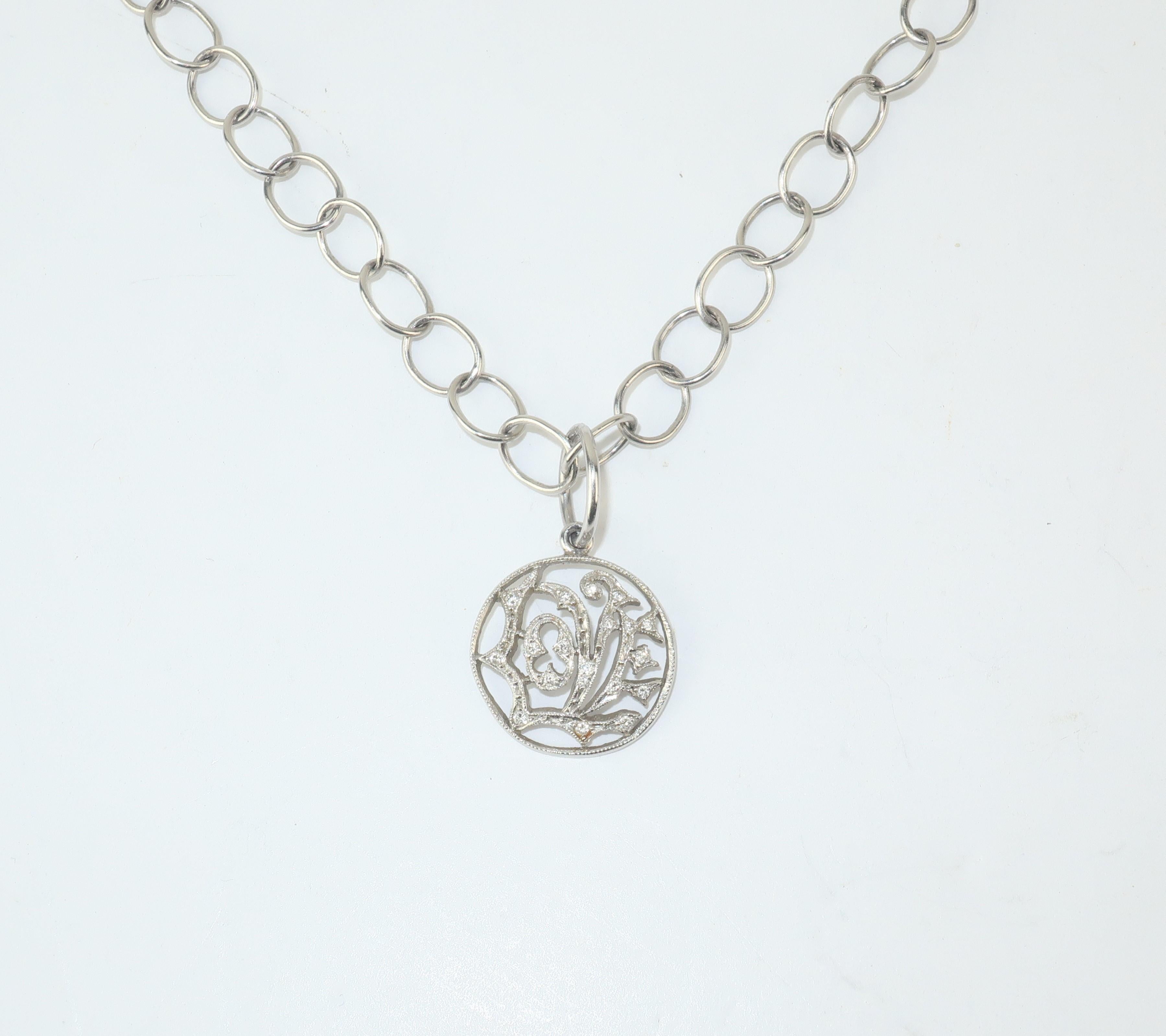 Beautiful Cathy Waterman 'Love' necklace combining a delicate aesthetic with an intricate platinum design accented by diamonds.  The toggle closure provides for easy wear and offers an artisan element to fine link necklace suspending the pendant. 