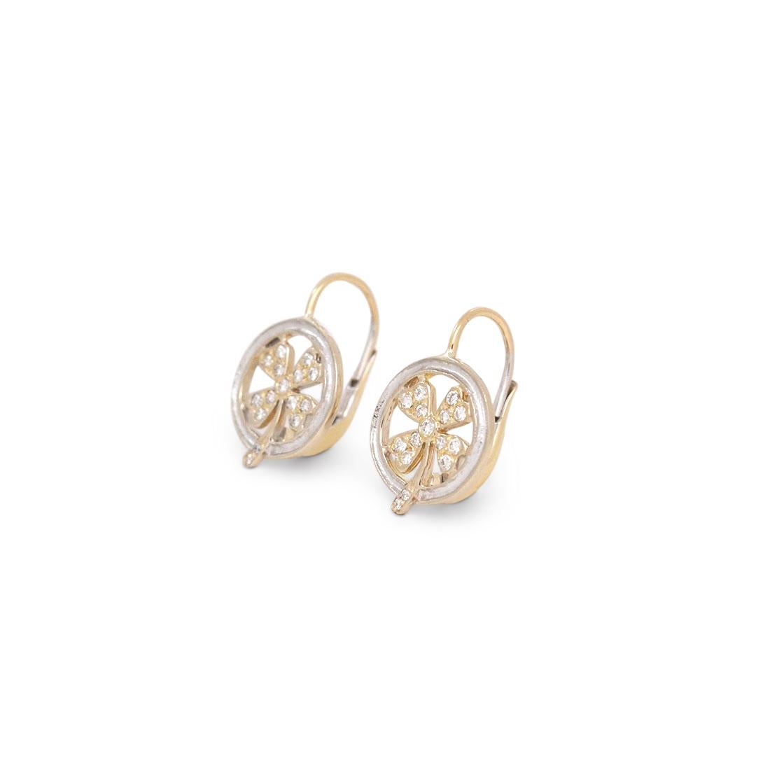 Authentic Cathy Waterman earrings crafted in platinum and 22 karat yellow gold. Each earring features a platinum bezel that encircles a yellow gold four-leaf clover set with round brilliant cut diamonds of an estimated .30 carat total weight. Signed