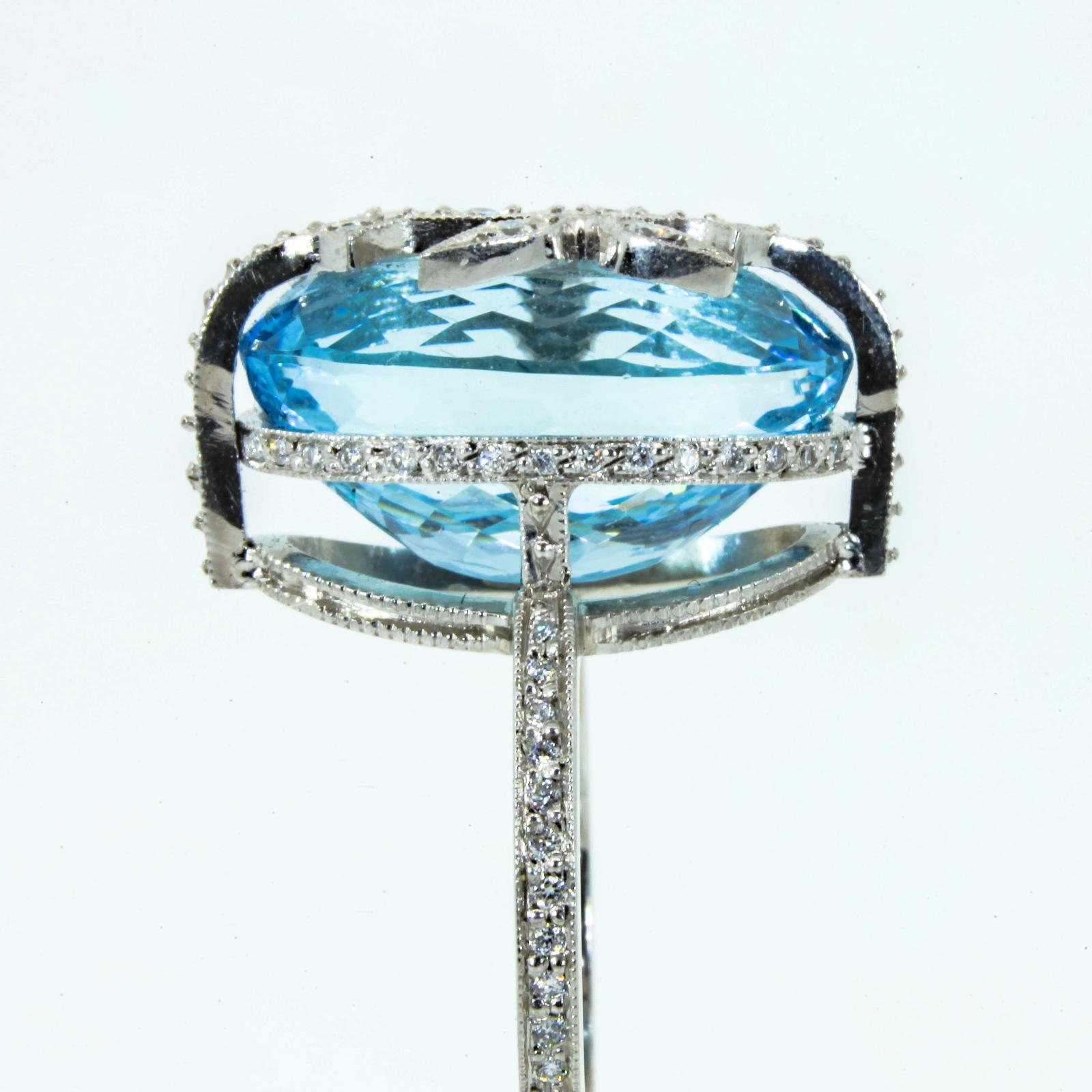 Fashionably Lovely, Cathy Waterman's  platinum ring flaunting an 8.00 carat oval blue Topaz.   The topaz is embraced in a diamond  micro pave setting, accented with Round Brilliant Cut Diamonds.  Ring size 6 3/4.  