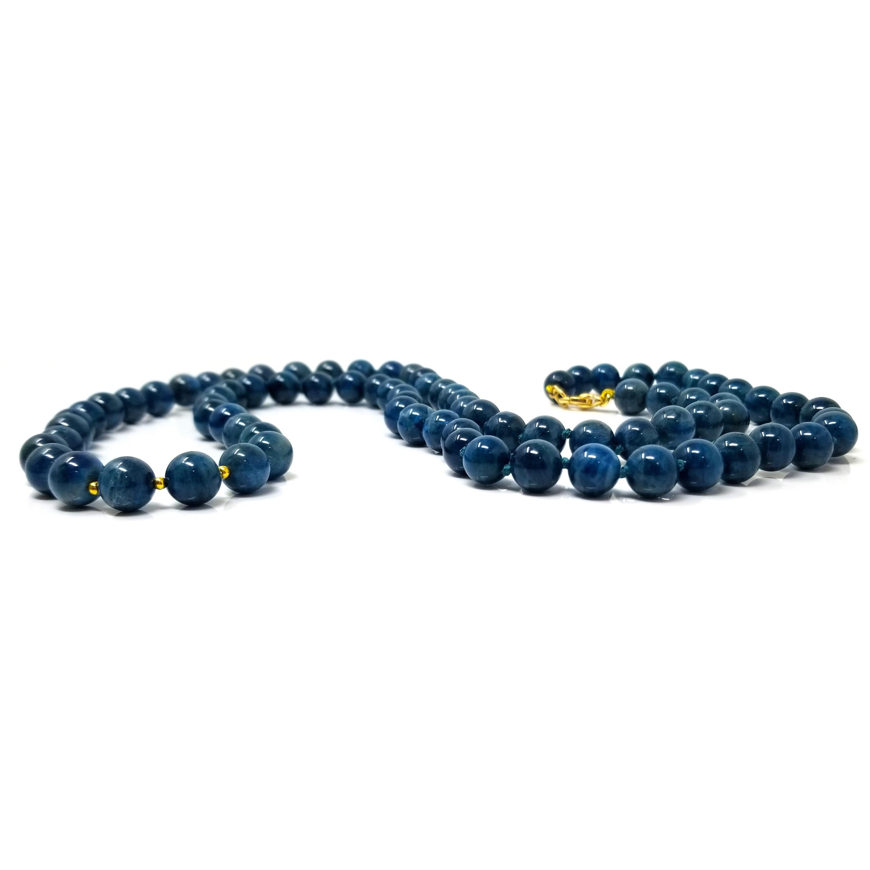 Gemstone beaded necklaces are such an effortlessly chic addition to any jewelry wardrobe. This necklace features cat's eye apatite in a rich shade of teal blue.

Delicate gold beads in one section add a subtle accent to the piece, and the lobster