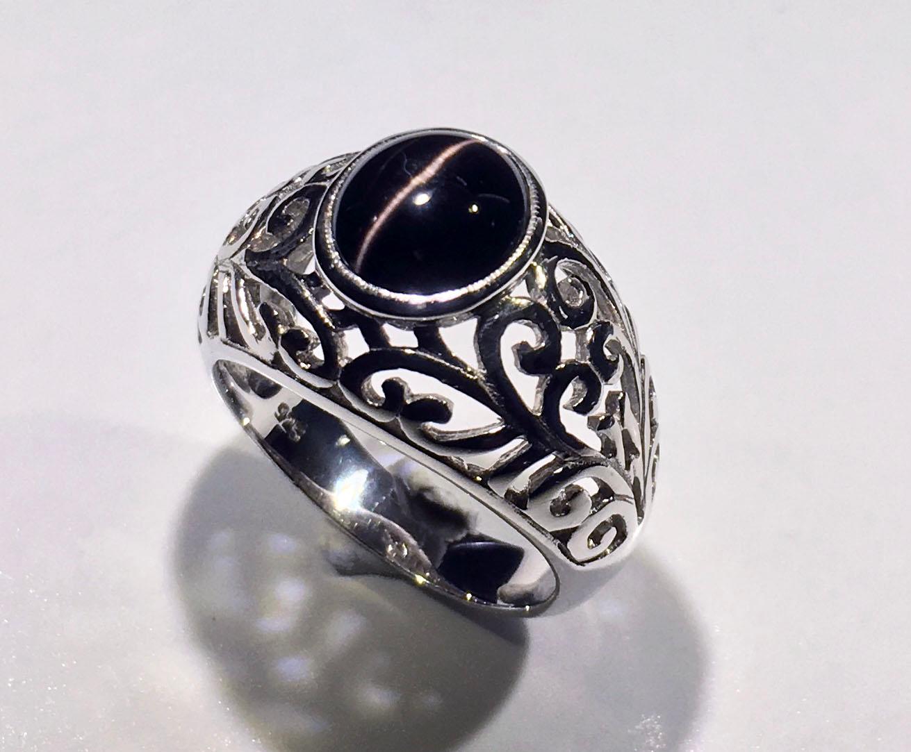Kary Adam Designed, Cats Eye Cabochon Sillimanite Silver Ring. This Silver ring is a Size 8 USA and has a Weight of 6.8 Grams. The Cabochon Sillimanite is 3.7 Carats and is Satisfying Mysterious Dark Black with a Vivid White Chatoyant Cats Eye.