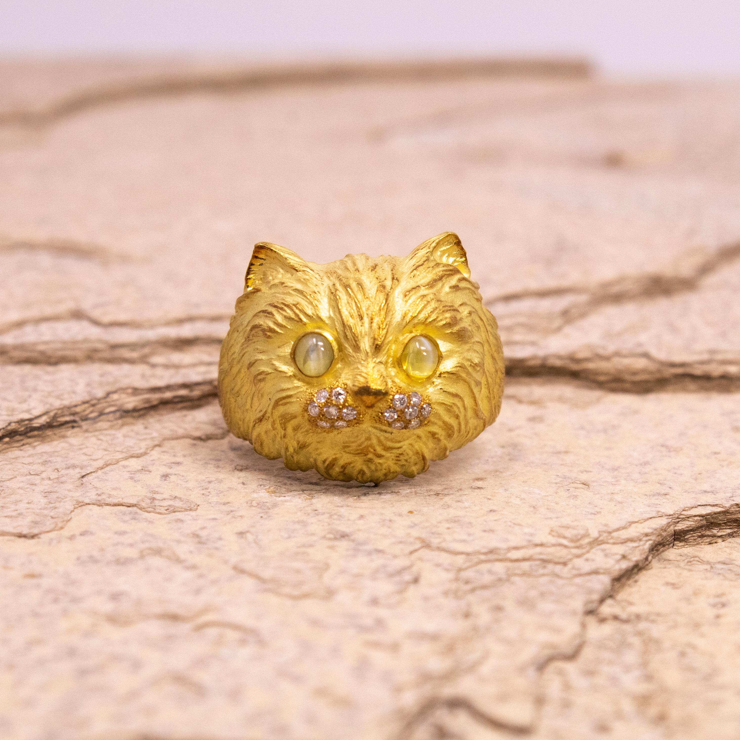 This exquisitely rendered 18kt feline ring is perfect for anyone who has an adoring cat (or two, or three!). The flashing cat's eye chrysoberyl are a perfect choice for this cat's eyes, and the beautiful quality diamonds give just the right amount