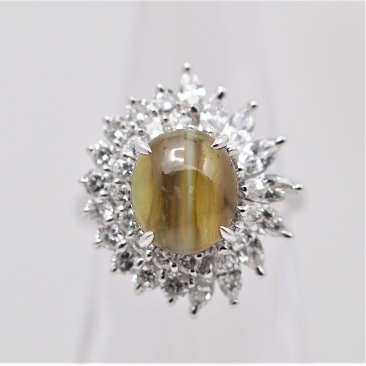 A beautiful ring featuring a fine gem-quality cats eye chrysoberyl weighing 5.34 carats. It has excellent chatoyancy (cats eye effect) as a strong “cats eye” can be seen across the stone as a light hits it’s top. It is accented by 1.72 carats of