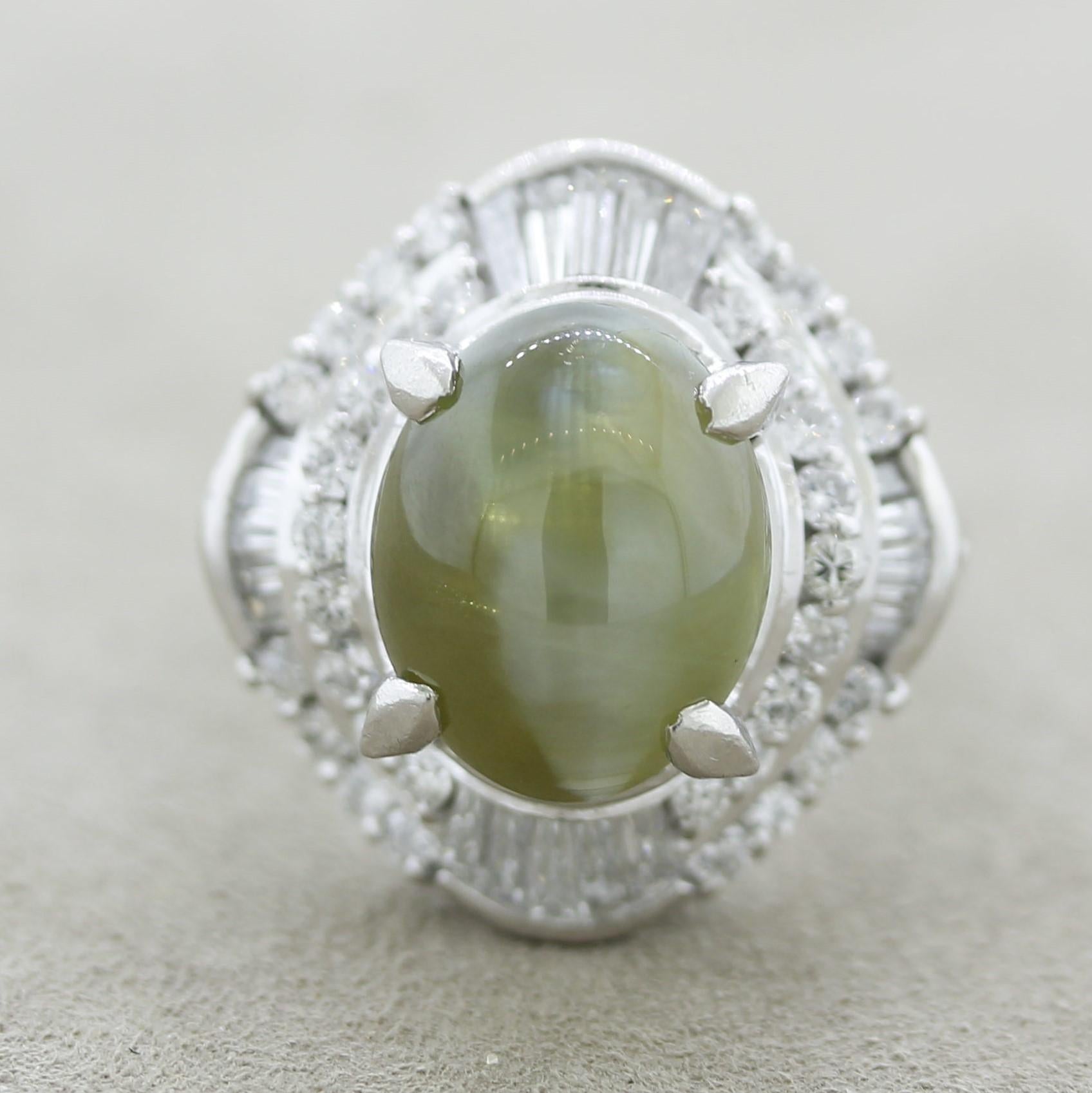 A lovely platinum made ring featuring a large natural cats eye chrysoberyl weighing 11.85 carats. It has a strong eye and a pleasing yellowish-green color. It is complemented by 1.38 carats of diamonds set around the gemstone in a stylish pattern.