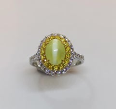 Cat's Eye Chrysoberyl with Yellow Diamond and Diamond Ring Set in 18 Karat