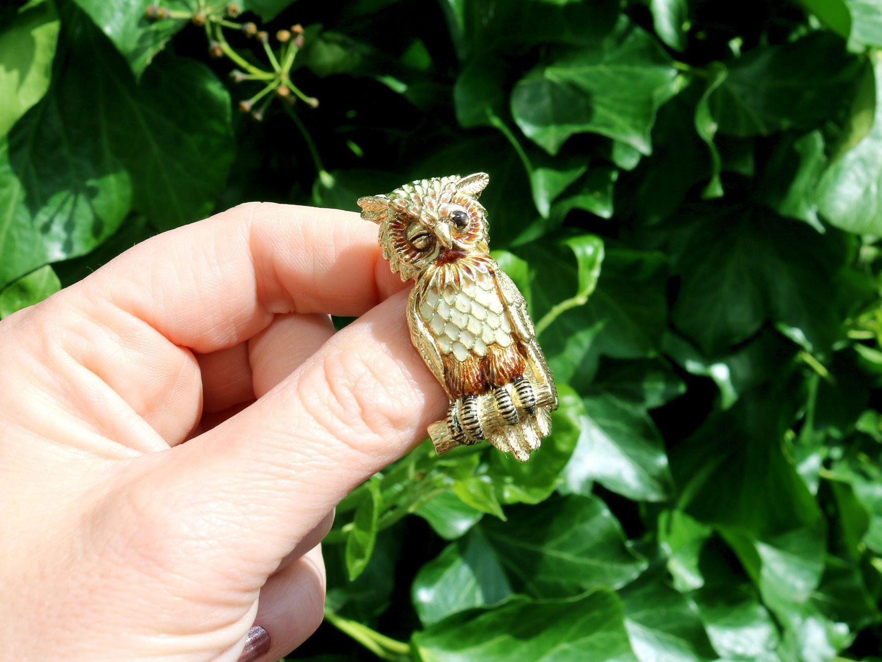 A stunning vintage 1950's 0.11 carat cat's eye, hot enamel and 18 karat yellow gold owl brooch made by Tiffany & Co; part of our diverse diamond jewellery and estate jewelry collections.

This stunning, fine and impressive vintage brooch has been