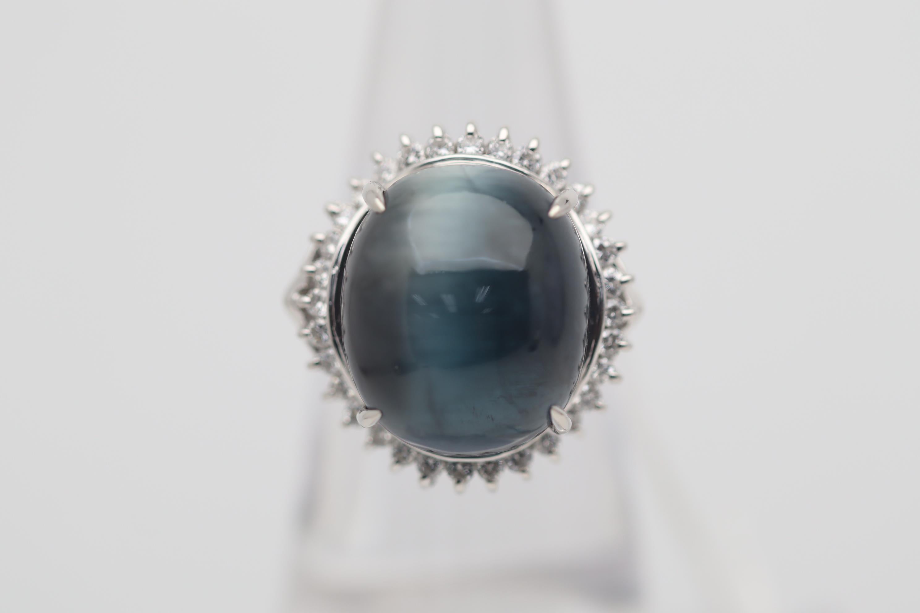 A large and impressive ring featuring a unique and rare gem! The beautifully colored tourmaline is known as indicolite for its rich slightly greenish-blue color. It weighs 18.59 carats and what makes it unique is its strong cats eye! Tourmalines are