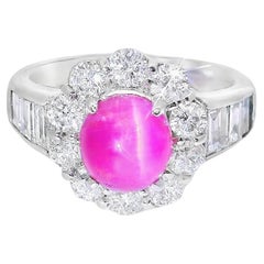Anello in platino con tormalina occhio di gatto e diamante aureolato