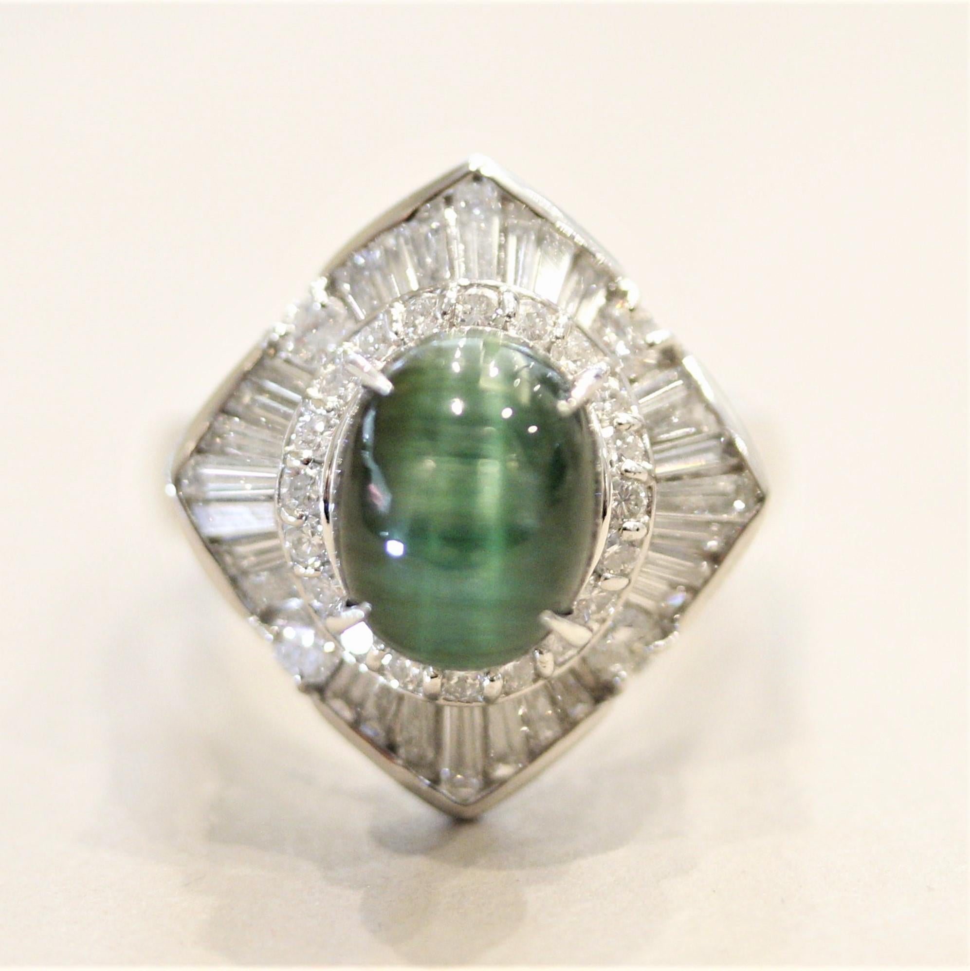 A unique tourmaline with chatoyancy aka cat’s eye effect! The 3.80 carat green tourmaline has an eye running down the stone and moves along with the light. It is accented by 1.45 carats of round brilliant-cut and baguette-cut diamonds set around the