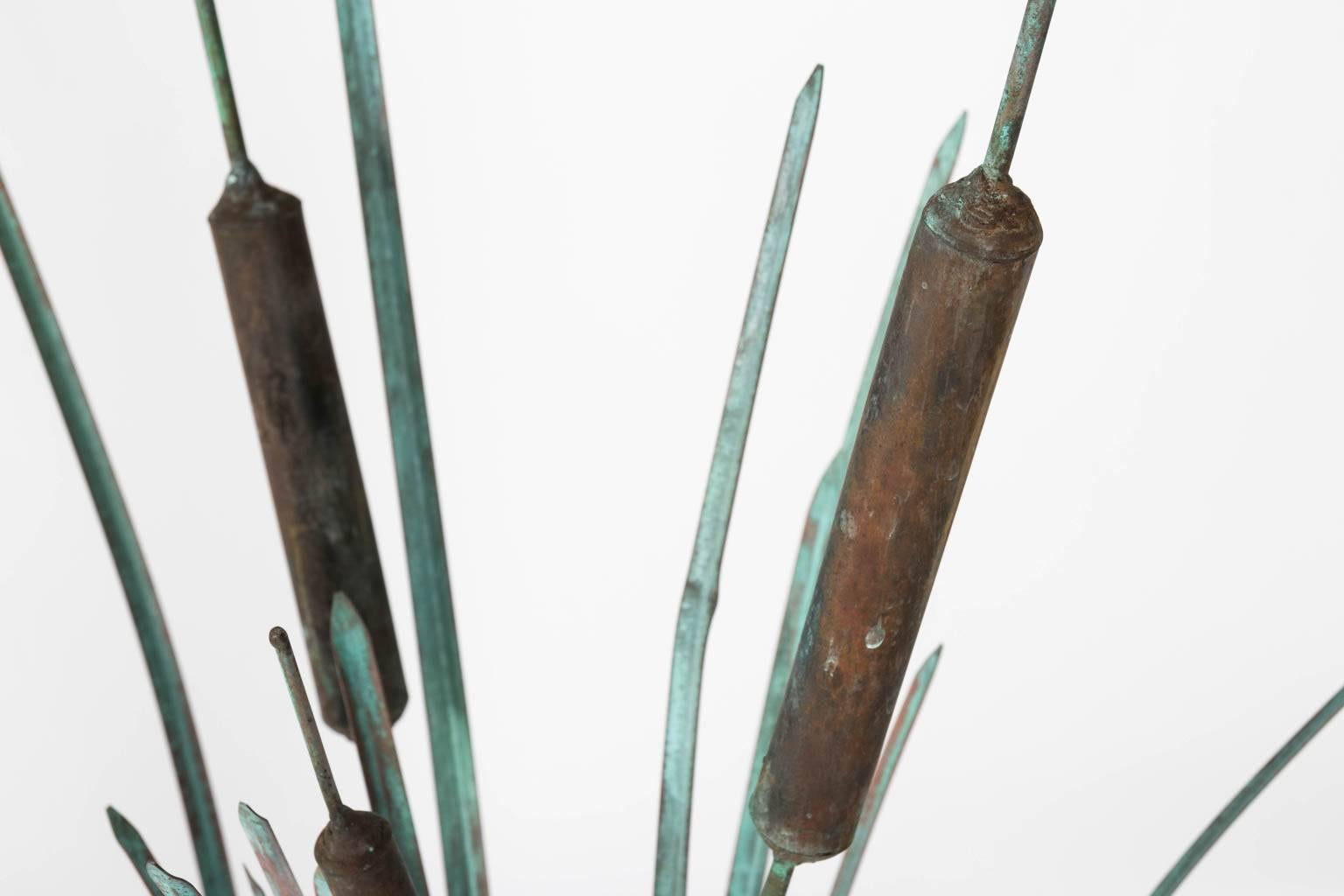Brutalist style copper cattail and lily pad sculpture in a weathered finish by Max Howard, circa 1970s.
 