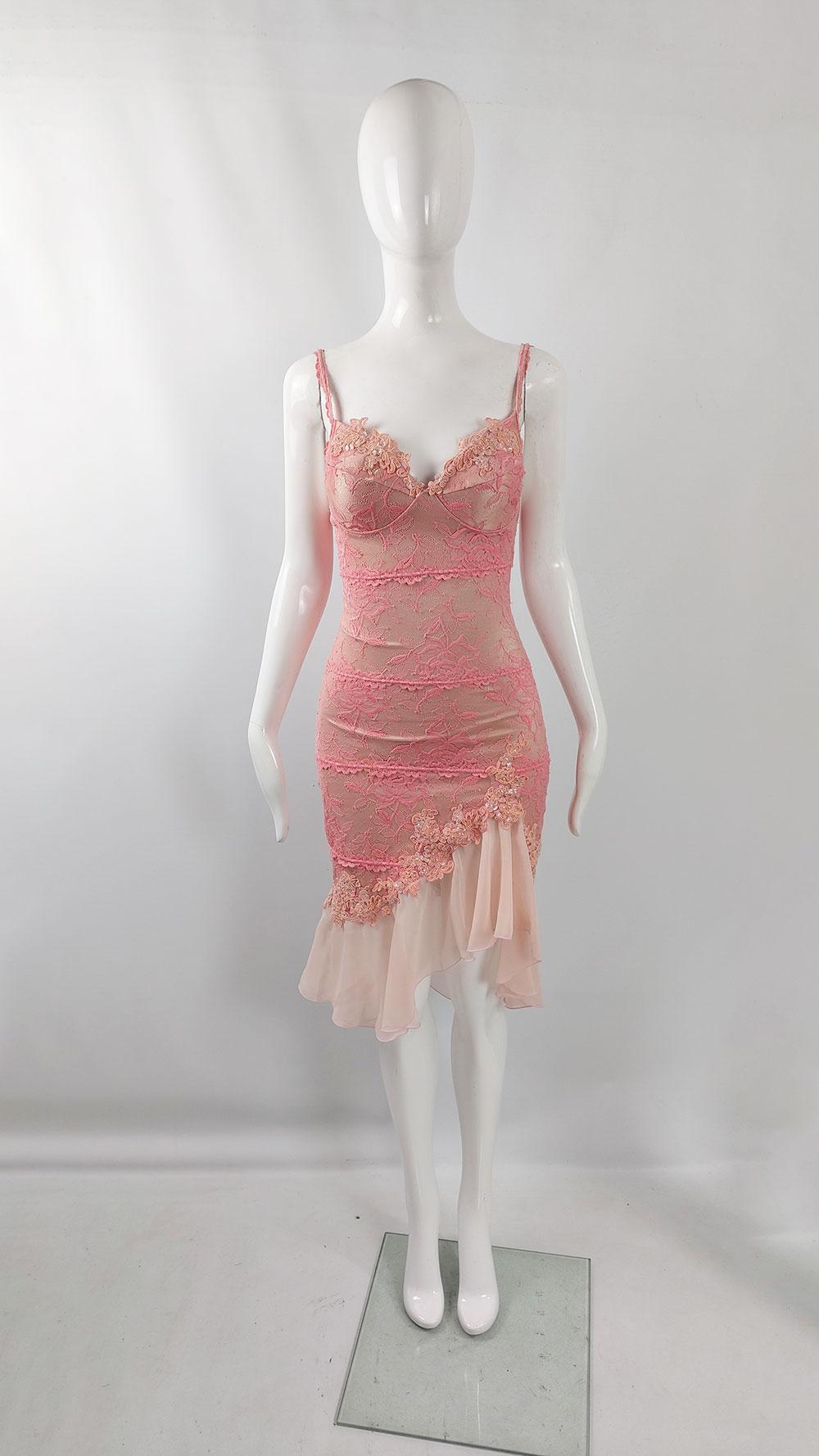 A stunning 2000s vintage women's dress by the iconic British label Catwalk Collection, celebrated for their sultry eveningwear, particularly sensuous and body-conscious dresses like this piece. This dress is crafted from pink lace over flesh-colored