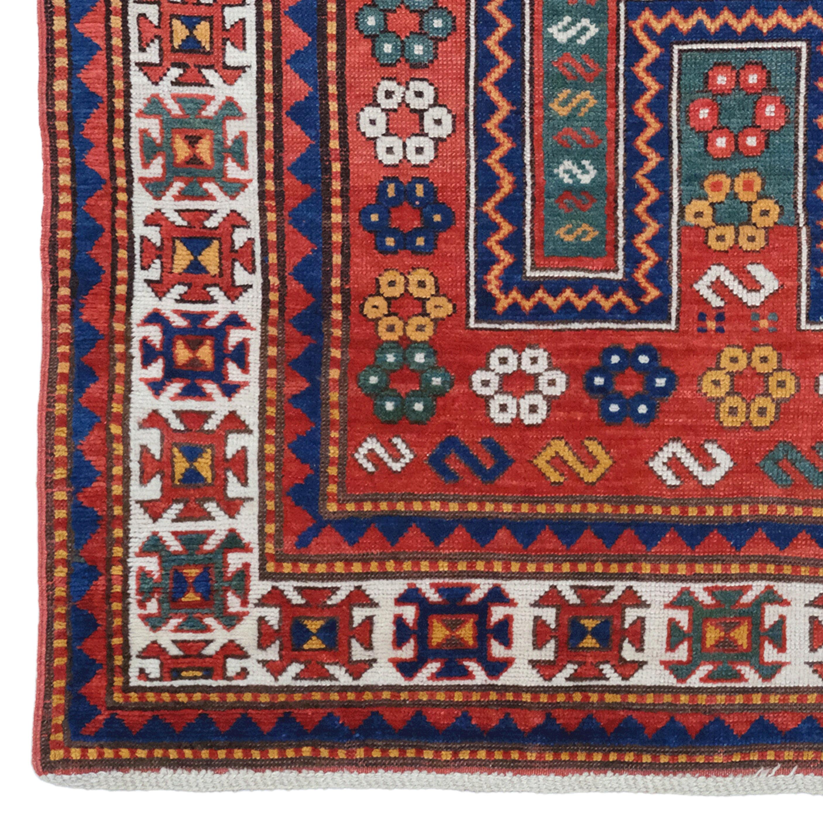 This antique Fahrola rug dates from the 19th century and stands out with its rich color palette and detailed patterns. In the middle of the carpet, there is a mihrab pattern decorated with floral motifs, dominated by blue and red tones. There is a