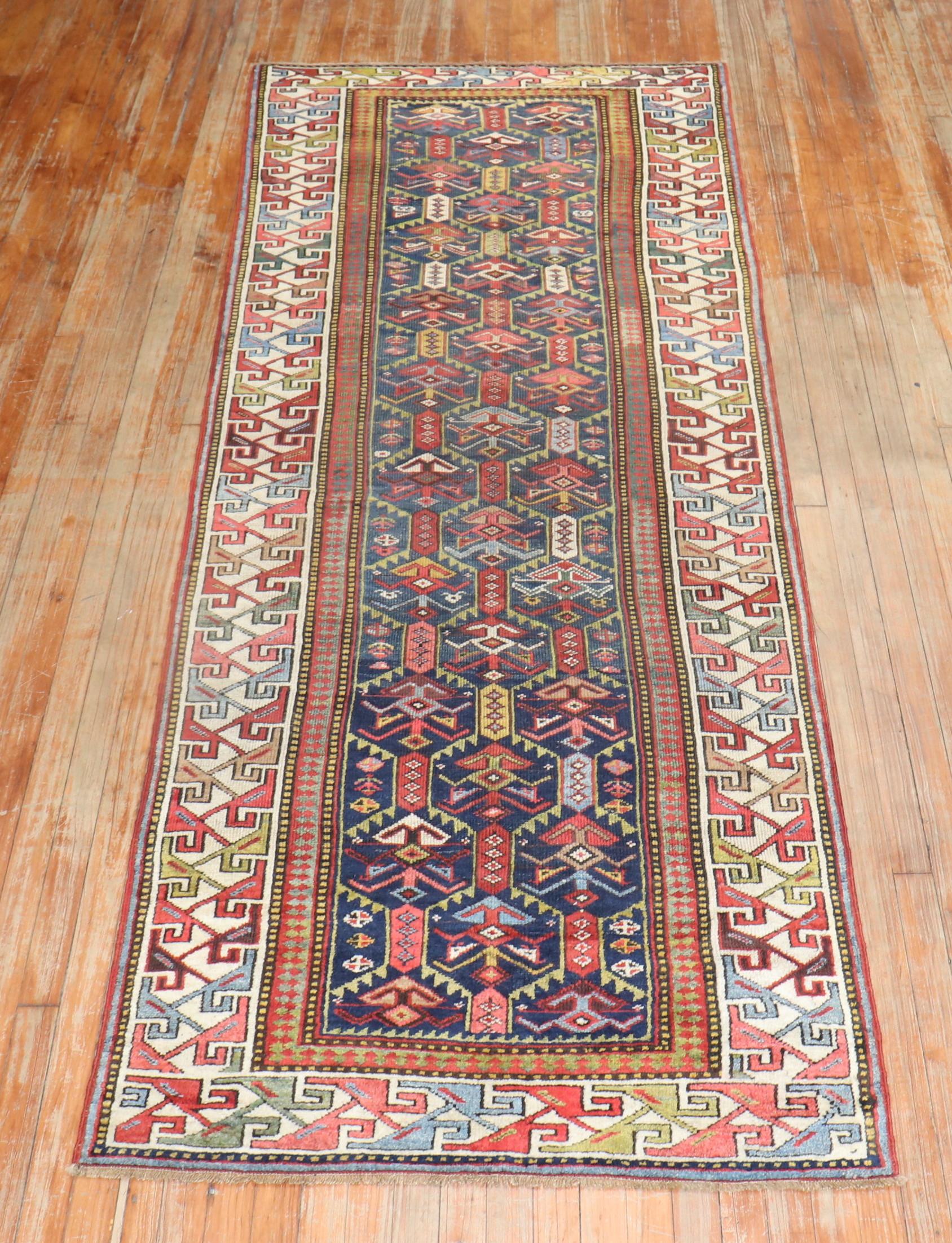 an early 20th Century Caucasian Gendje Runner

3'5'' x 9'9''

“Gendje rugs were frequently made in a long, narrow format, and a large number of runners were produced too…the polychrome octagon borders…can be identified as distinctive features of