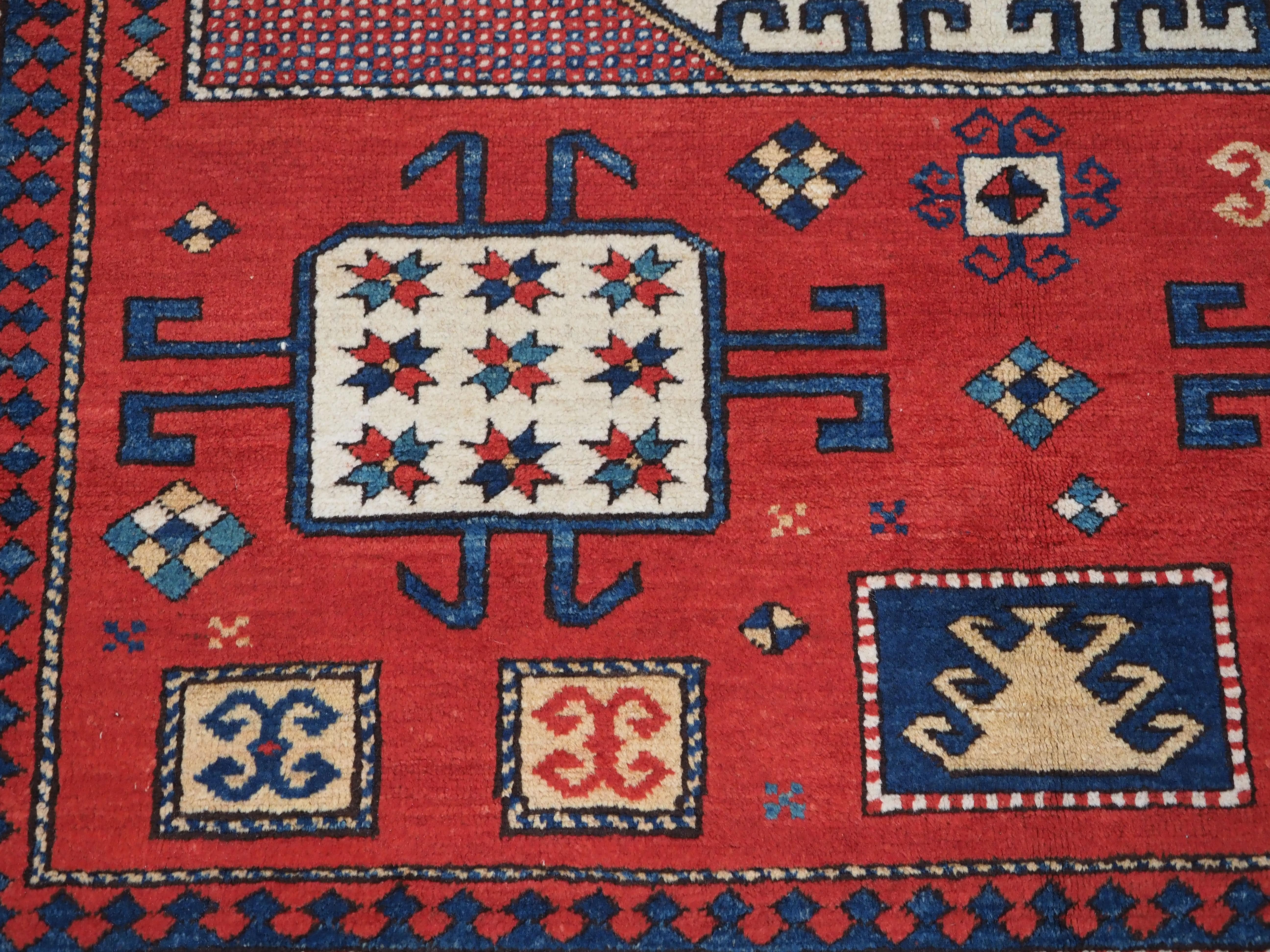 Caucasian Karachov Kazak style rug of classic design on a red ground For Sale 8
