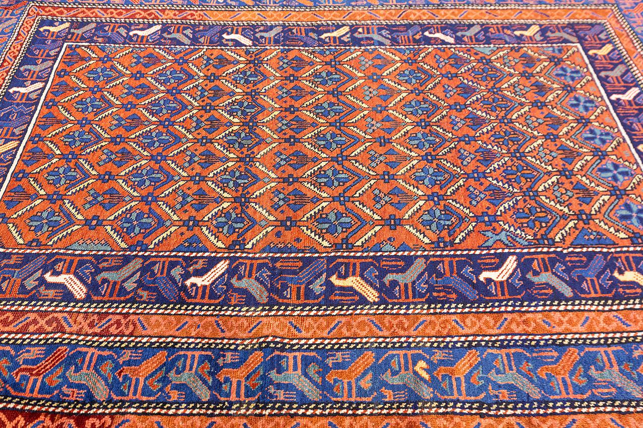 This rug is a stunning example of traditional Caucasian design. The all-over pattern and stylized birds on the border make it a unique and eye-catching piece. This rug is  woven with high quality materials and is sure to last for many years. It