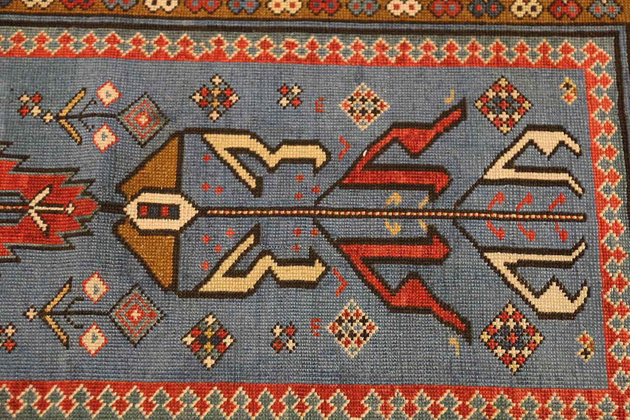 This is a Kuba Runner from the northern part of Azerbaijan and was woven during the end of the 19th century. This runner is a rare example of a Kuba rug due to the light blue field color and that the drawing of the field is well spaced and not