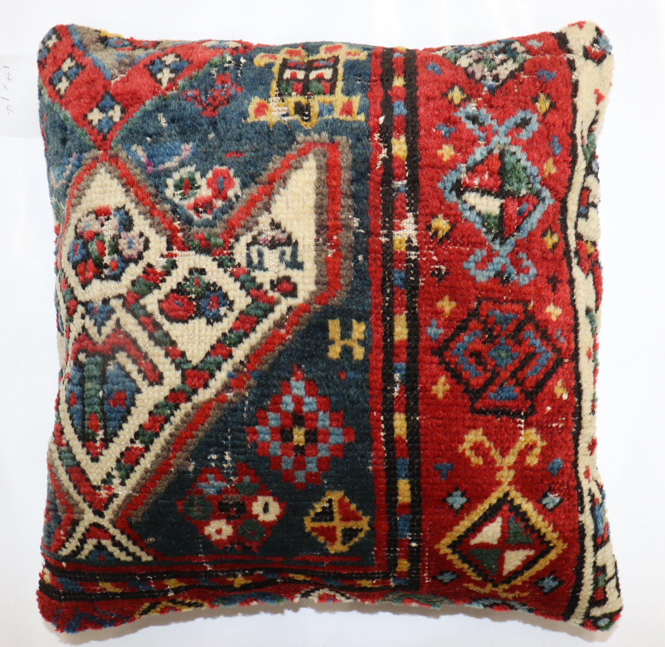 Pillow made from an early 20th century Caucasian rug. zipper closure and poly-fill insert provided.

Measures: 16