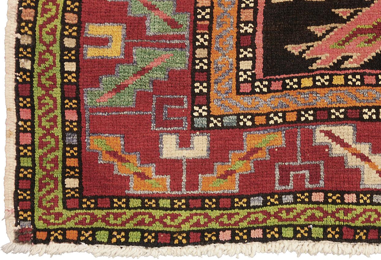 This antique Karabagh rug measuring 270 × 125 cm (8' 10
