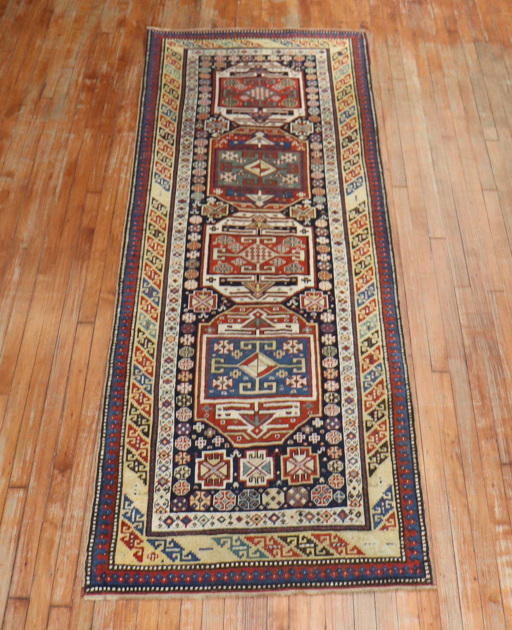 An early 20th century Caucasian Shirvan runner. Rust, ivory red dominant accents on a navy ground.

Measures: 3'2