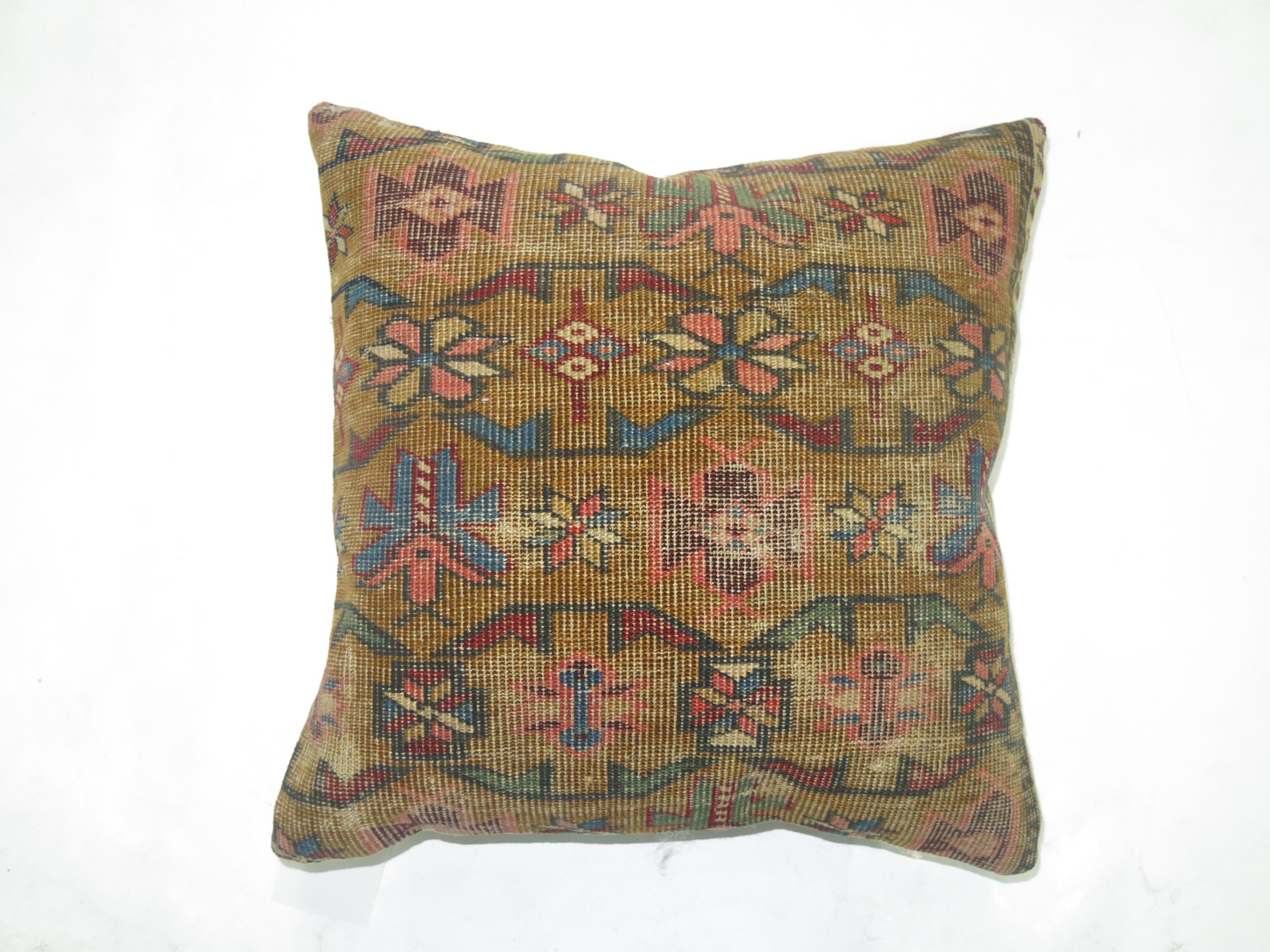 Pillow made from an antique 19th century Caucasian rug with cotton back. Zipper closure. Age wear.

Measures: 15'' x 16''.