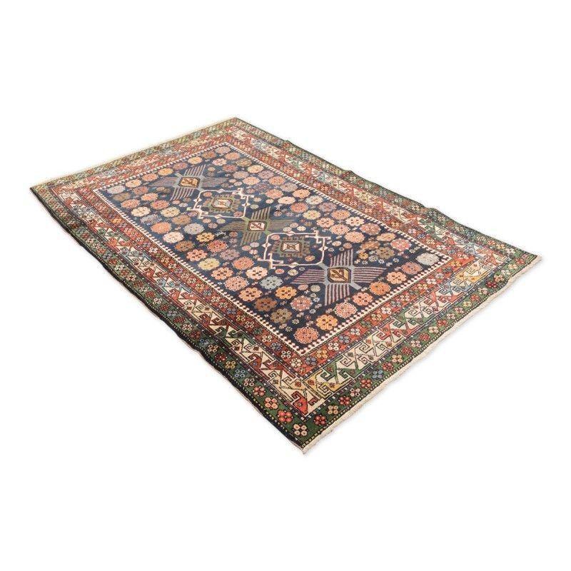 Rug of the Caucasus region. It is worth mentioning its color and typical format of the rugs of the production of Shirvan.
19th Century Woolen Caucasus Shirvan Rug with Geometric Design
- Geometric design, stars, flowers and crosses in different