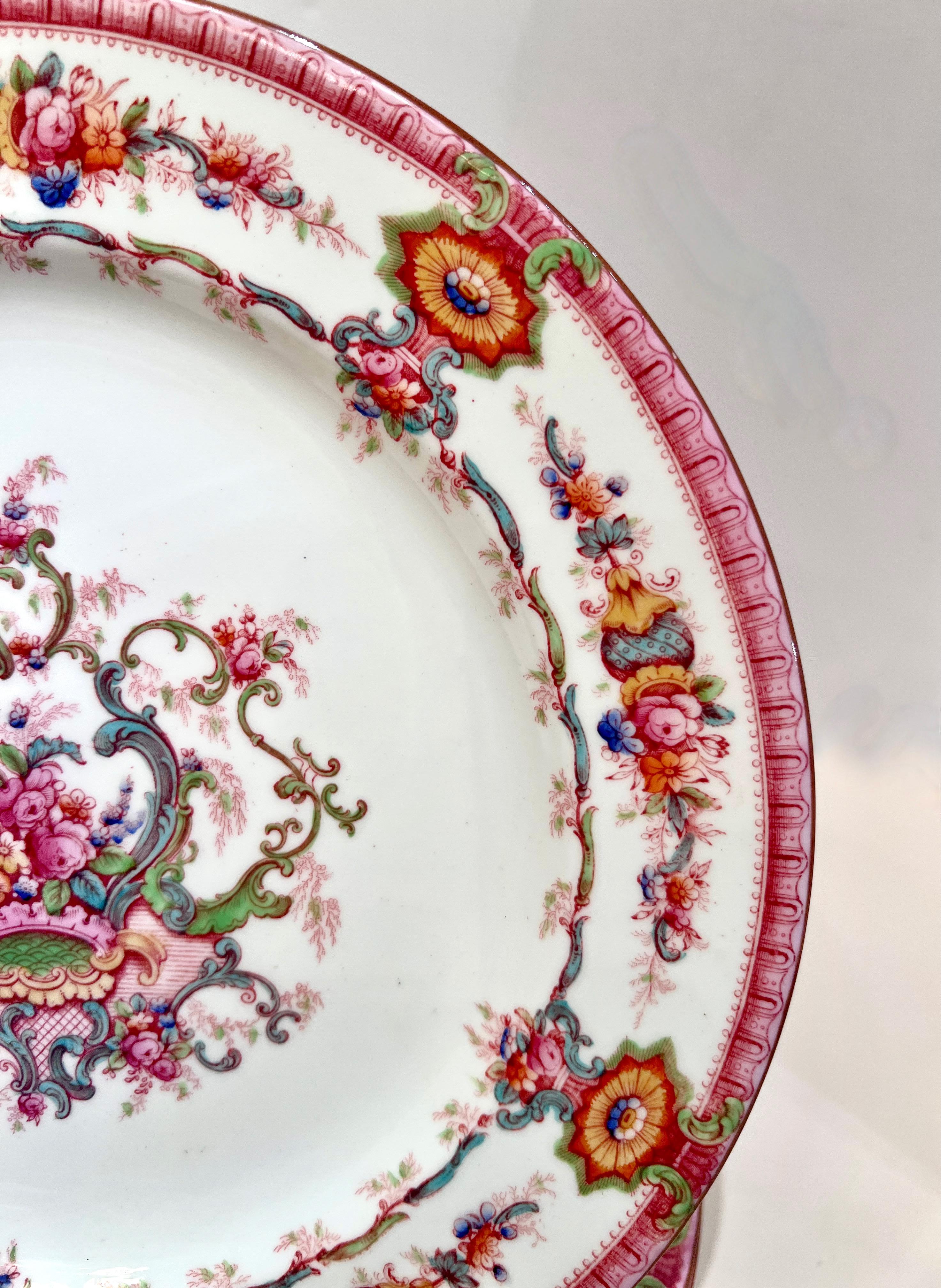 This is a beautifully decorated set of 12 Cauldon dinner plates that date to the first half of the 20th century. All of the plates are in very good condition and are ready for your next dinner party. The rims of the plates are decorated with 5