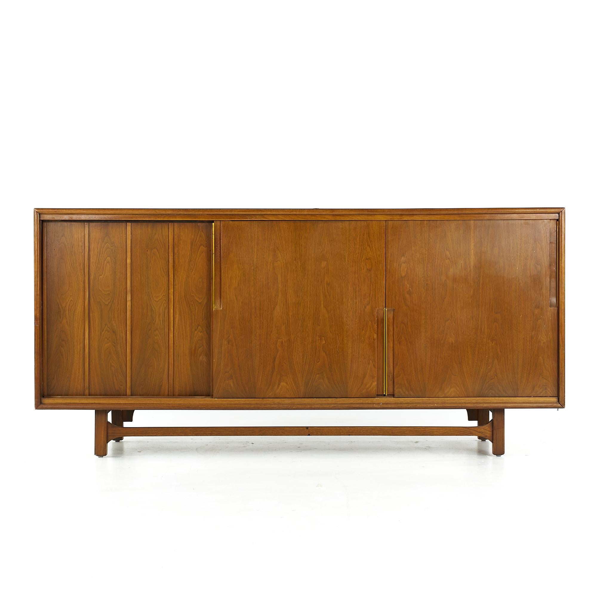 Cavalier Furniture midcentury brass and walnut lowboy dresser.

This lowboy measures: 72 wide x 21 deep x 34.5 inches high

All pieces of furniture can be had in what we call restored vintage condition. That means the piece is restored upon