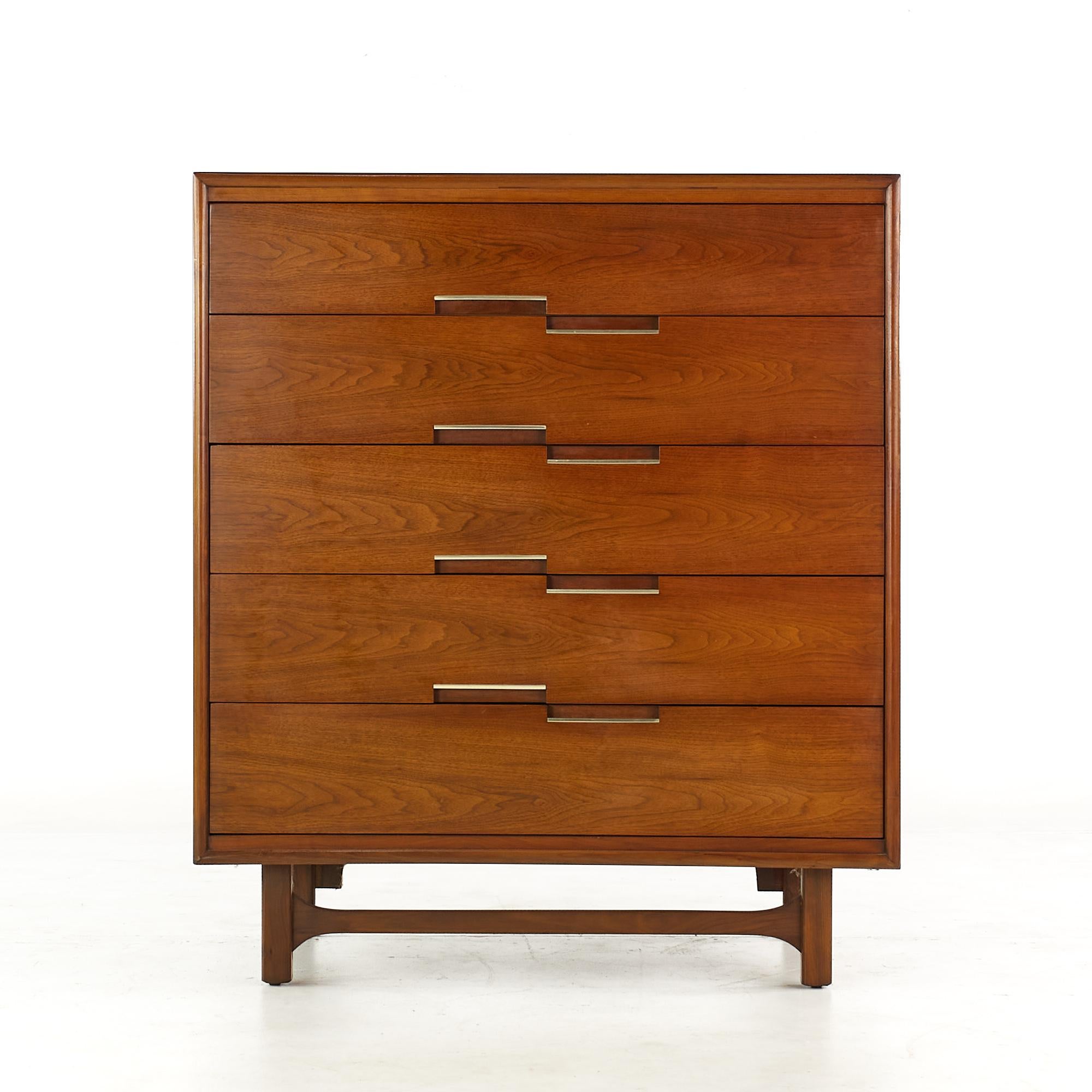 Cavalier furniture mid century walnut and brass highboy dresser.

This highboy dresser measures: 38 wide x 21 deep x 44.25 inches high.

All pieces of furniture can be had in what we call restored vintage condition. That means the piece is