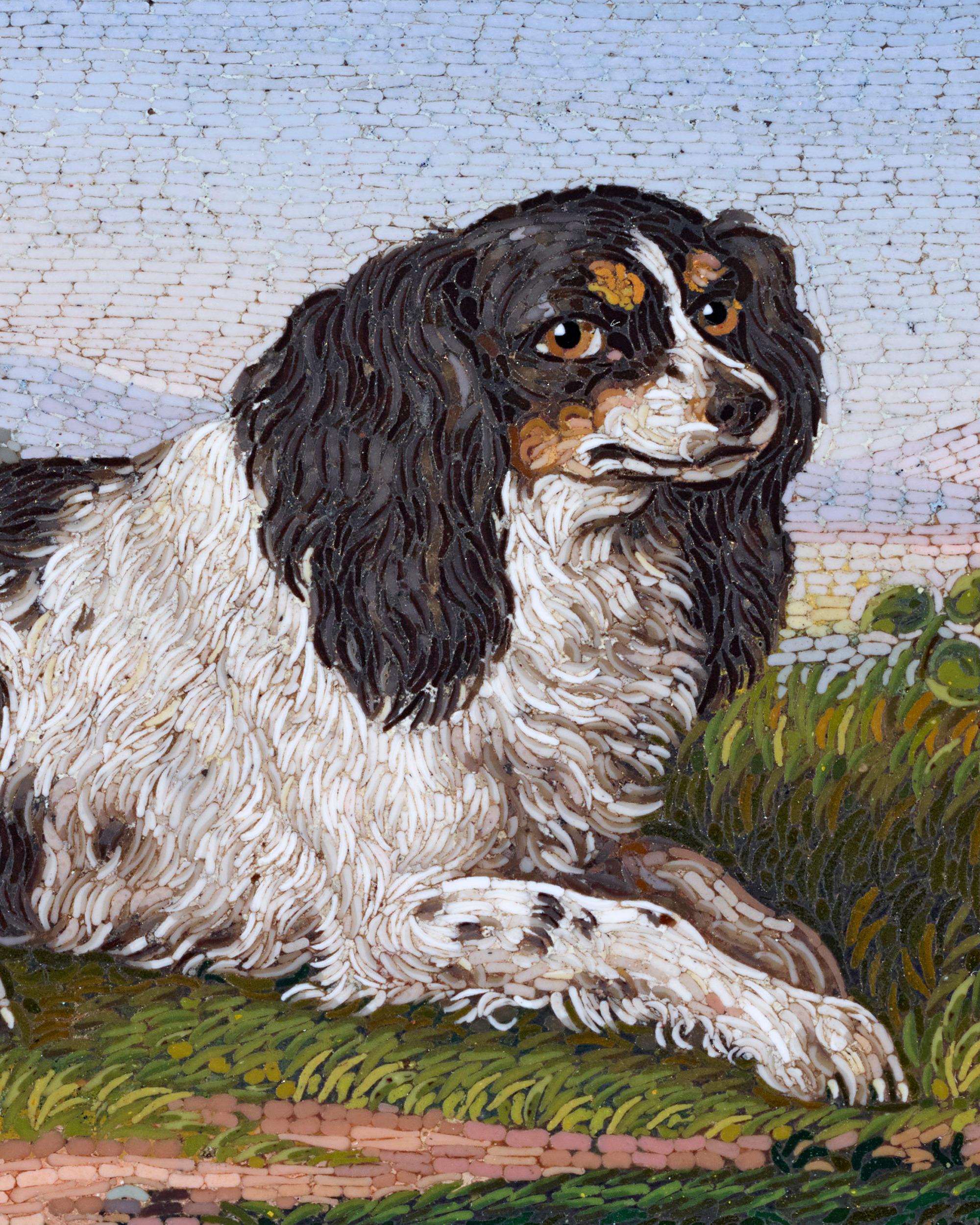 This charming Victorian-era micromosaic brooch is a wonder of meticulous craftsmanship and intricate design. Depicting a friendly Cavalier King Charles Spaniel, it is designed after a micromosaic plaque by Antonio Aguatti that now resides in the
