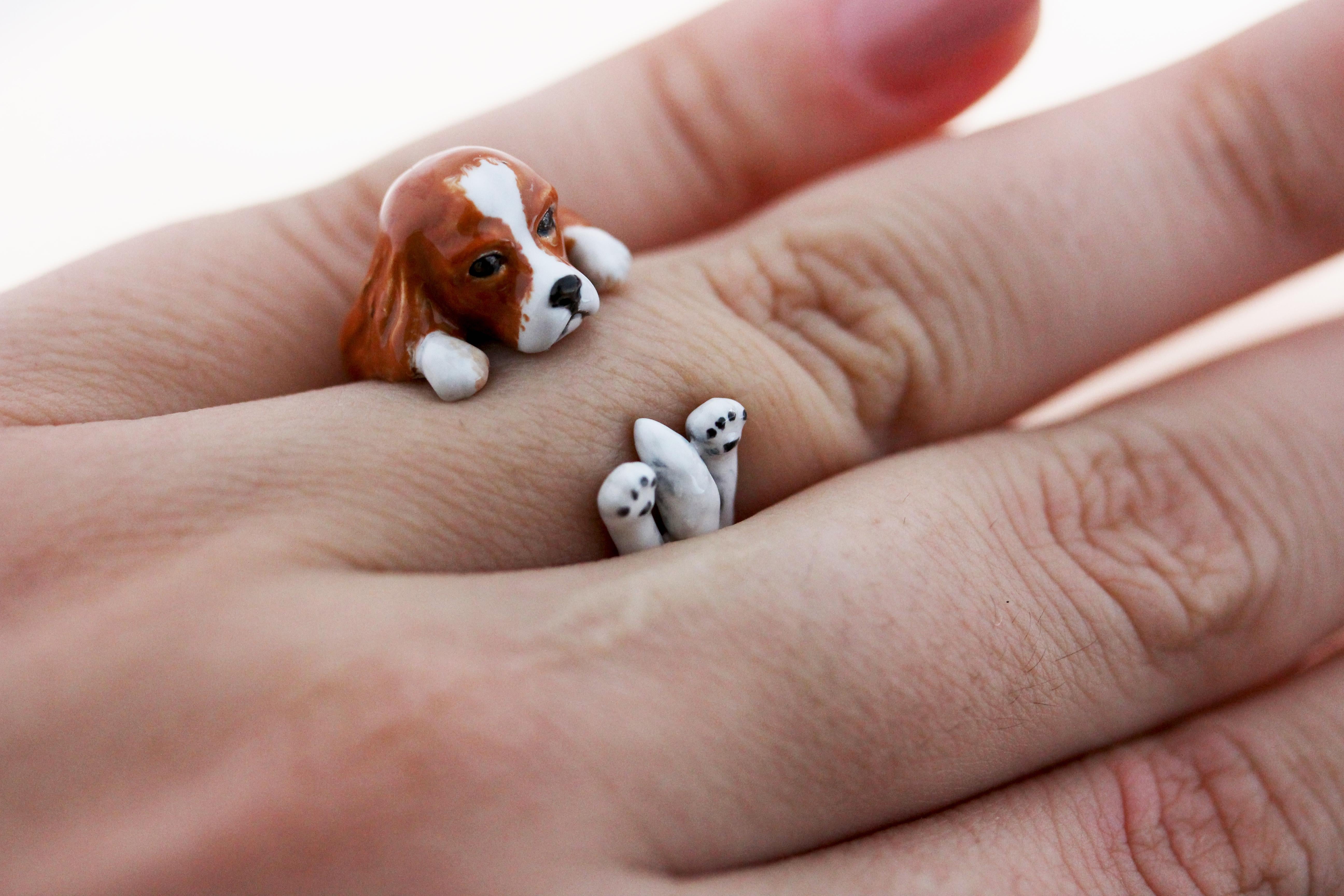 Ring made in sterling silver 925 featuring a Cavalier King, thanks to amazing hand enamel life-like features is vividly rendered. 

The AVGVSTA Dog ring is hand made and 100% customizable. 
We offer free engraving-perfect for dog's name or the owner
