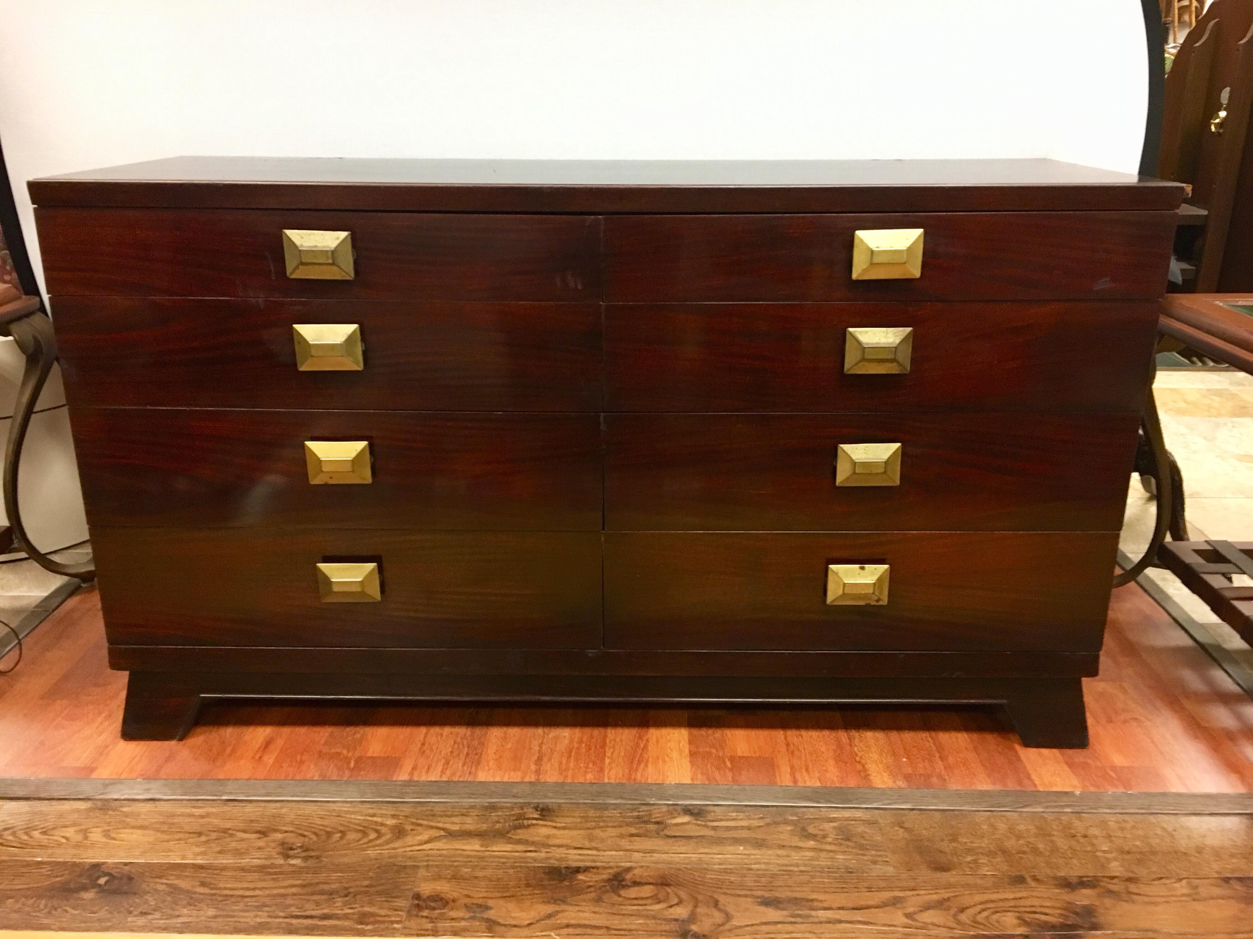 Cavalier Furniture eight-drawer dresser with large architectural brass pulls.