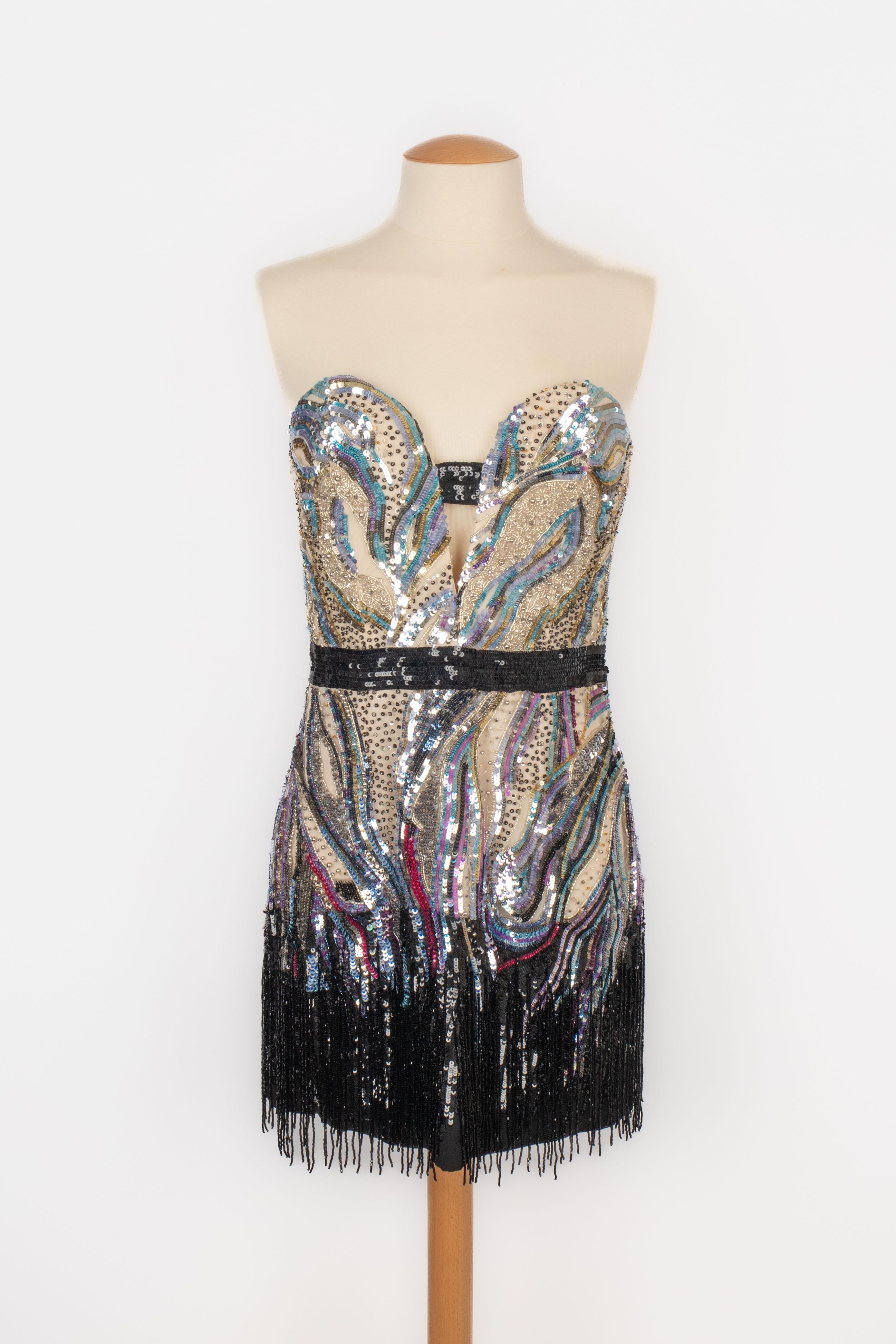 CAVALLI - Viscose and polyamide mini evening bustier dress embroidered with pearls and sequins in pink, blue, silvery, and black tones. It ends with fringes. Size 40IT.

Condition:
Very good condition

Dimensions:
Chest: 42 cm - Waist: 35 cm -