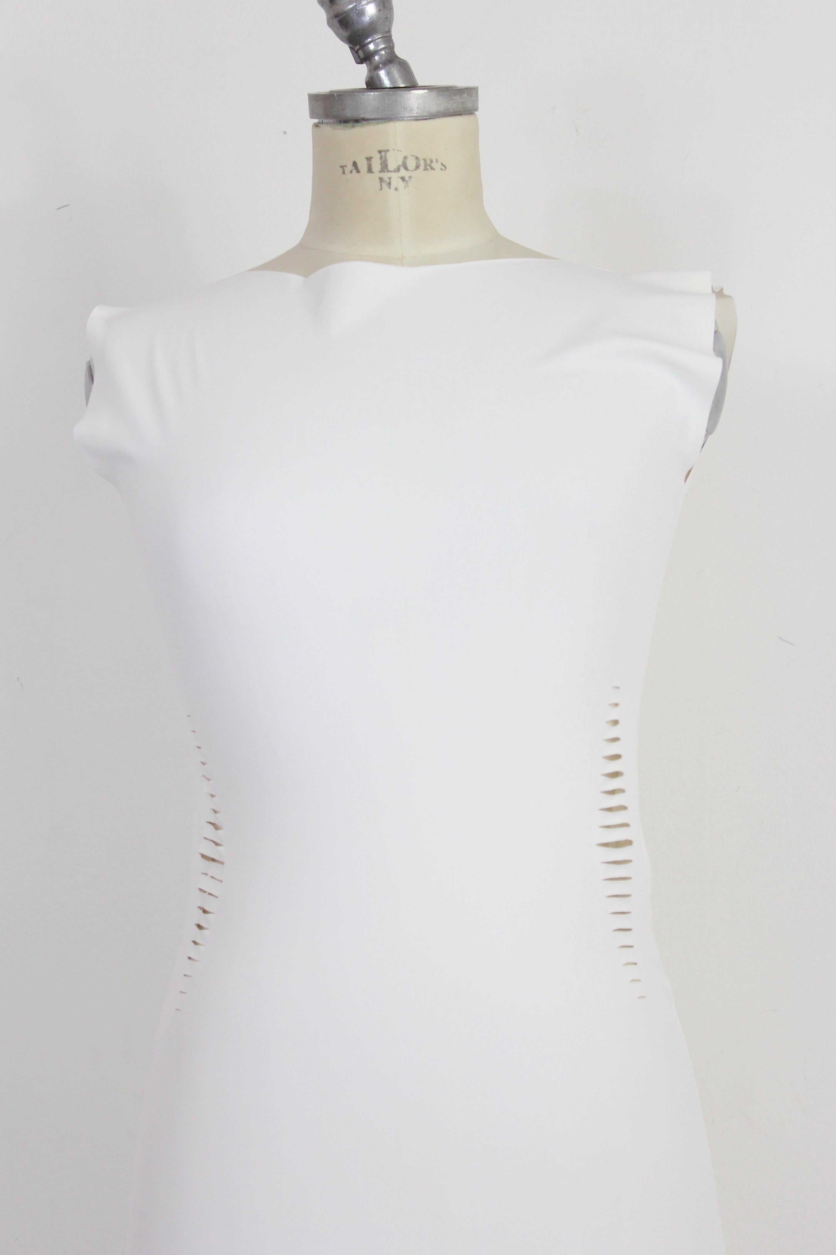 Cavalli Freedom 2000s woman dress. Fitted sheath dress, white, transparent. Laser cut all over the dress. Fabric 72% polyamide 28% elastane. Made in Italy. In the photos a card has been inserted to show the fit of the dress at its best.

Condition: