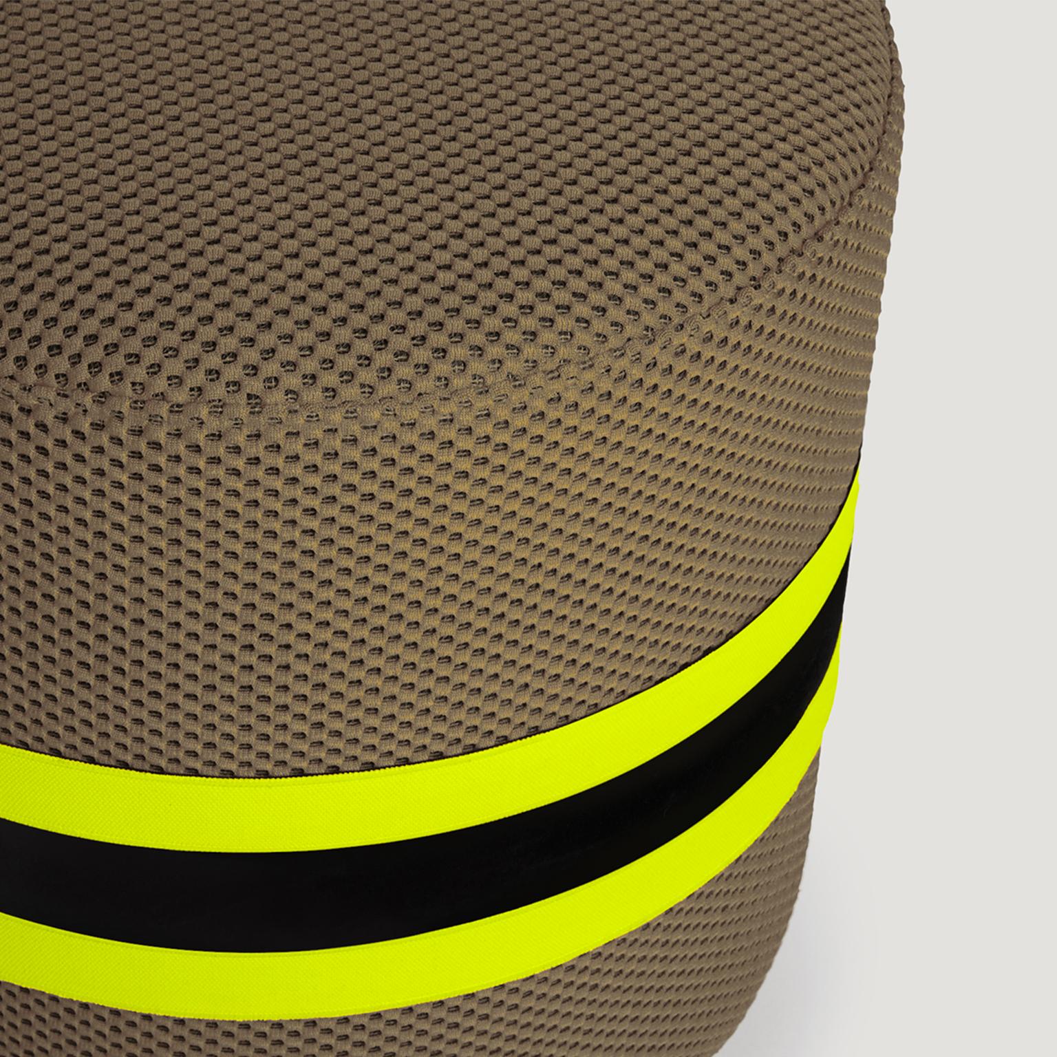 Stool with polyurethane base upholstered in Body Building fabric with elastic synthetic bands in neon yellow and black.
In “Body Building” the objects are dissected and studied, designed to elude the perception of the viewer, to discover a world