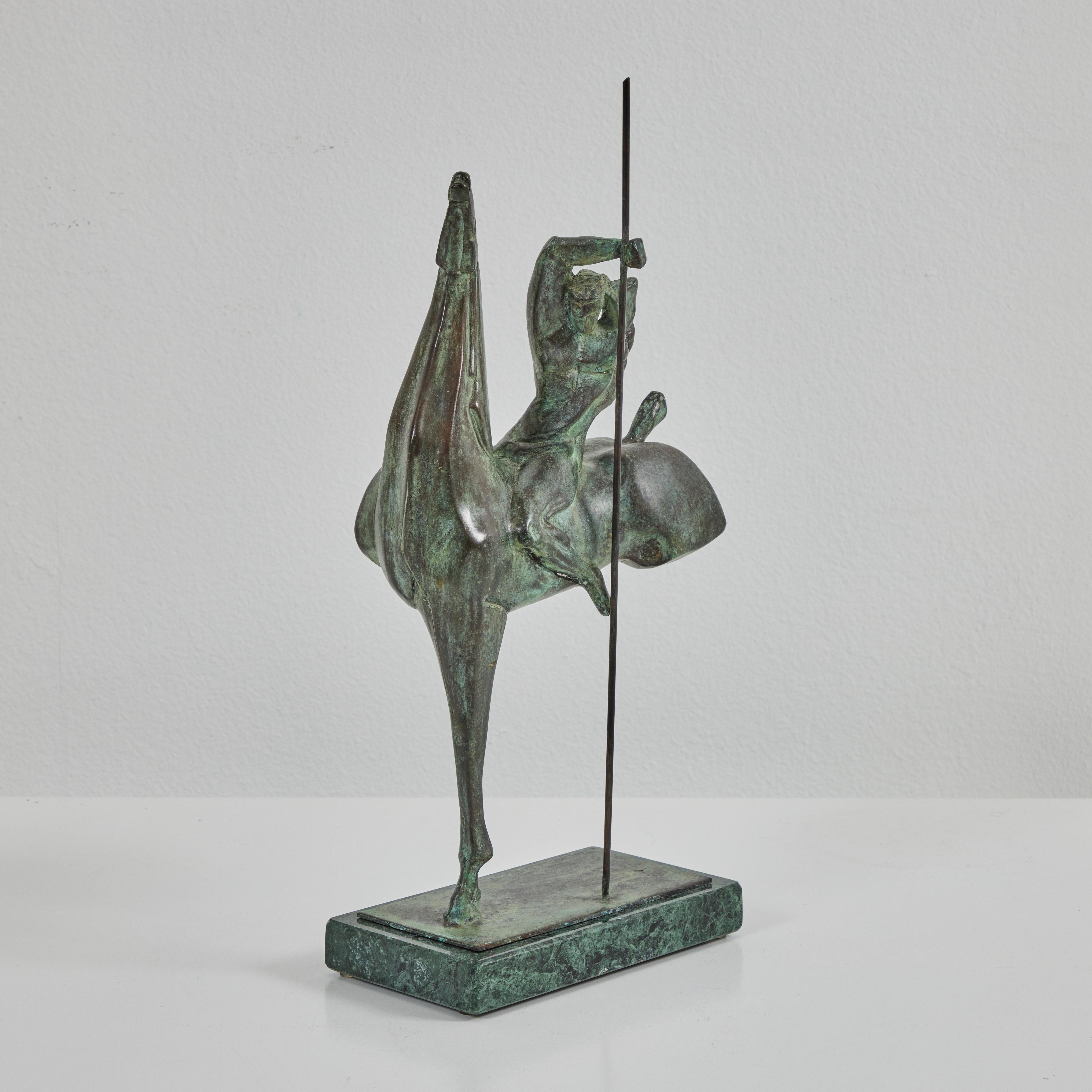 This sculpture by Claudio Nicoli portrays a cavalier on a horse with a staff. The unique patina creates the appearance of texture. The base is marble. The piece has been signed by Claudio Nicoli and numbered 3/6 on the rear of the horse. 

Born in