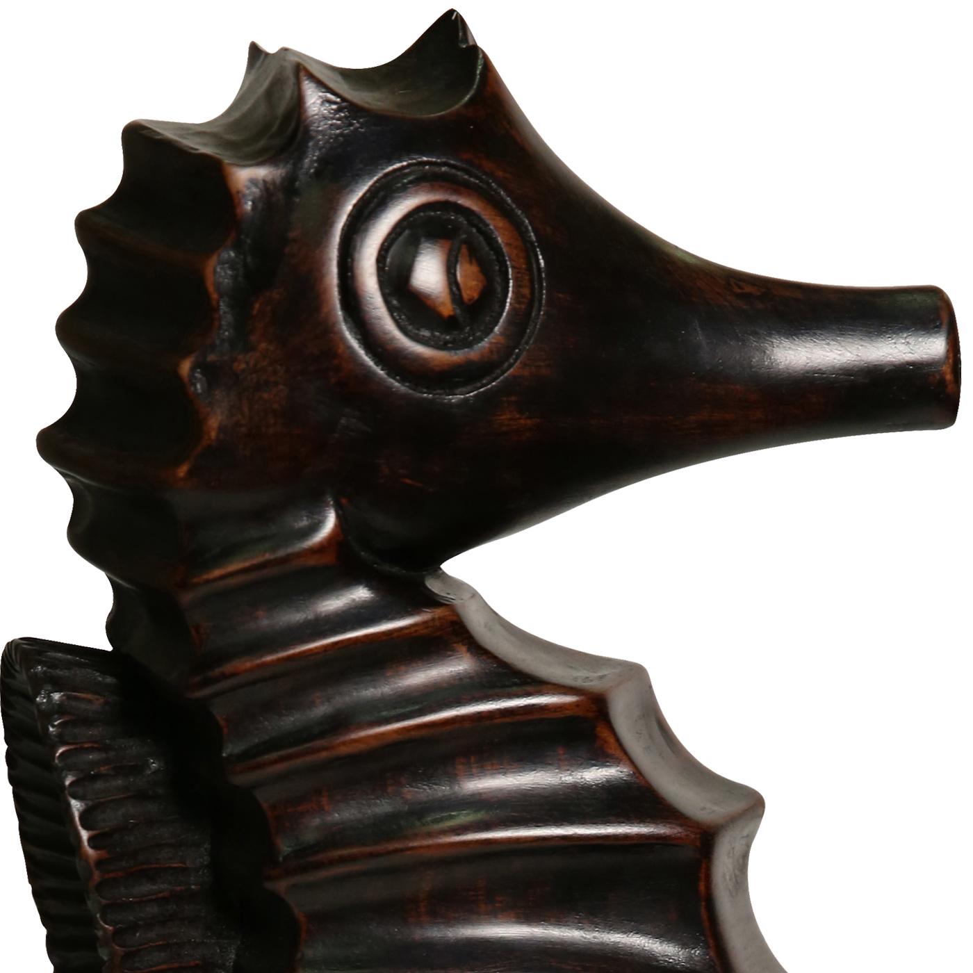This is a stylistic decorative seahorse by Florentine carver Castorina. The decorative sculpture is entirely hand-carved and finished with a black ebony shellac.
